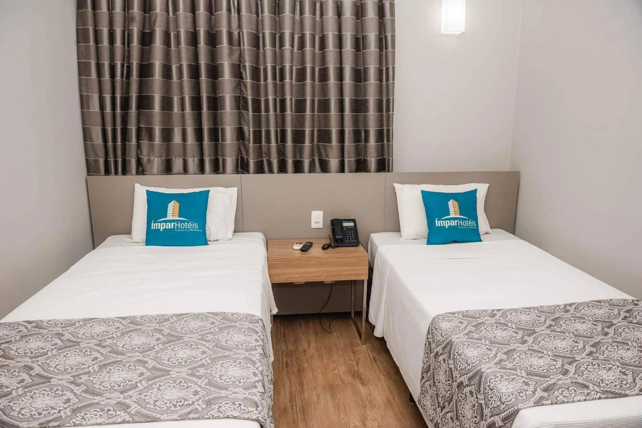 Bed in Ímpar Suítes Expominas