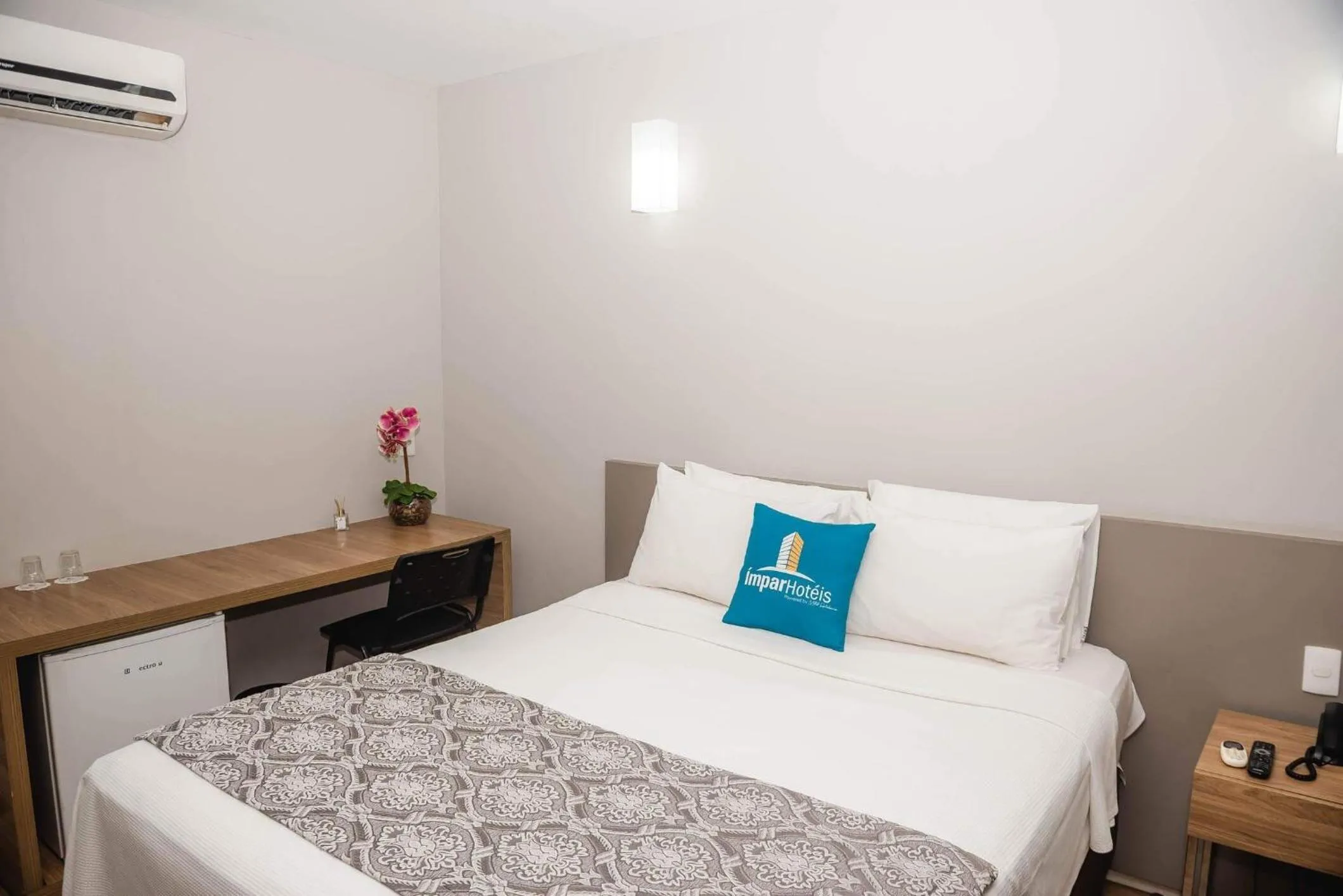 Bed in Ímpar Suítes Expominas