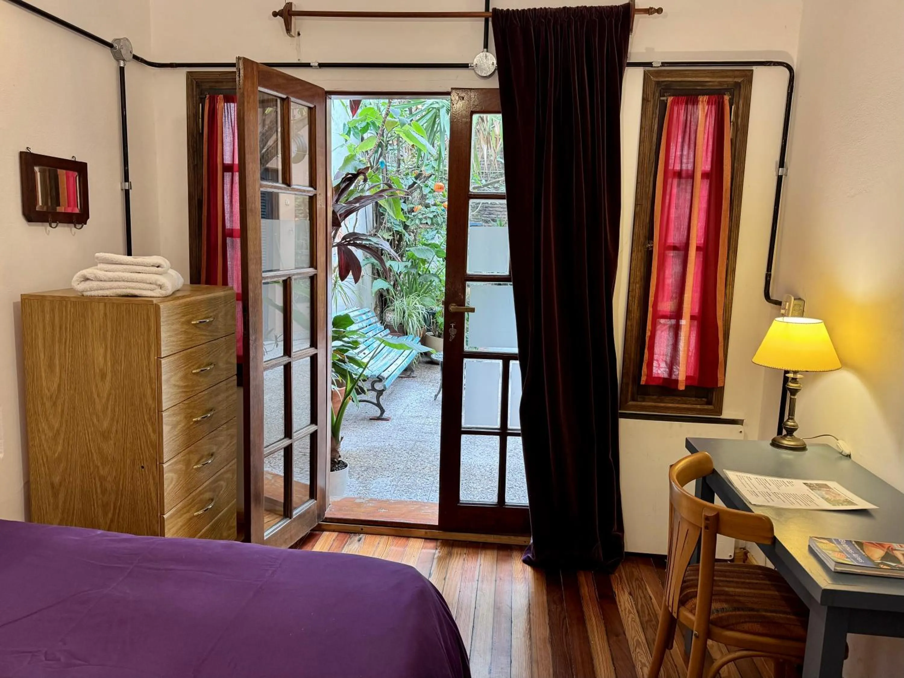 Inner courtyard view, Bed in Lina's Tango Guesthouse