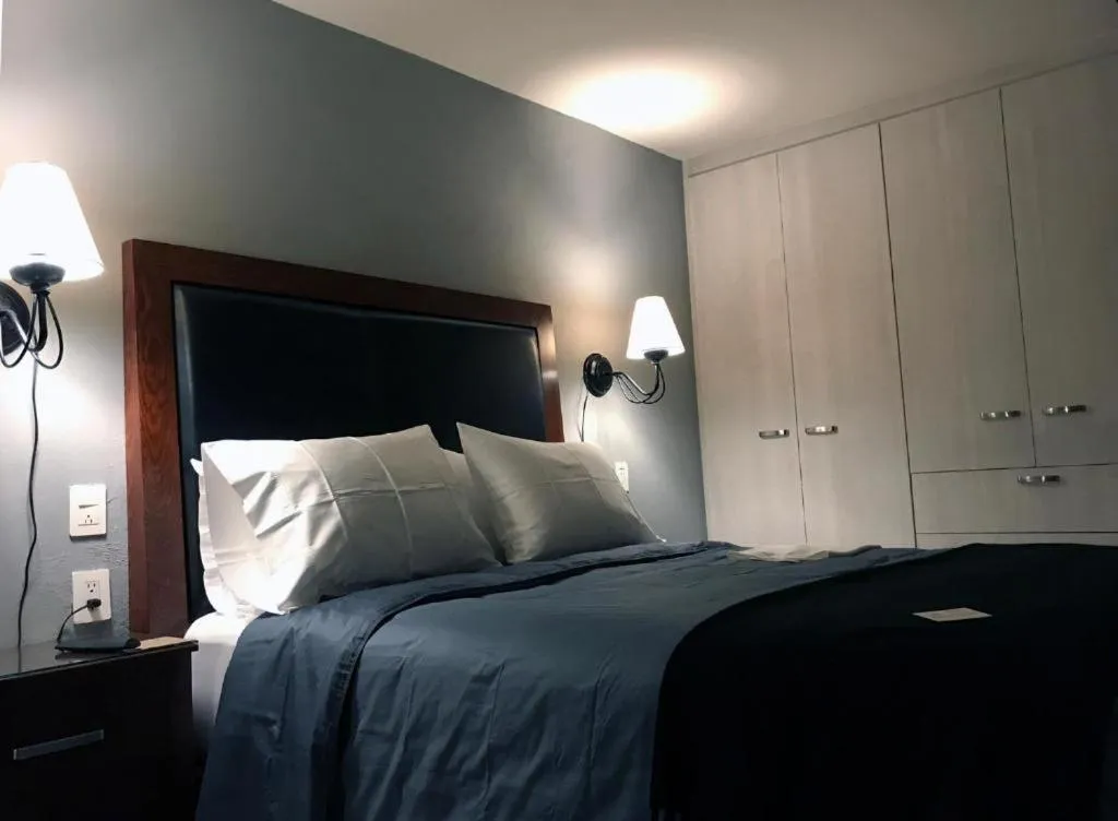 Bed in La Perla Hotel Boutique B&B