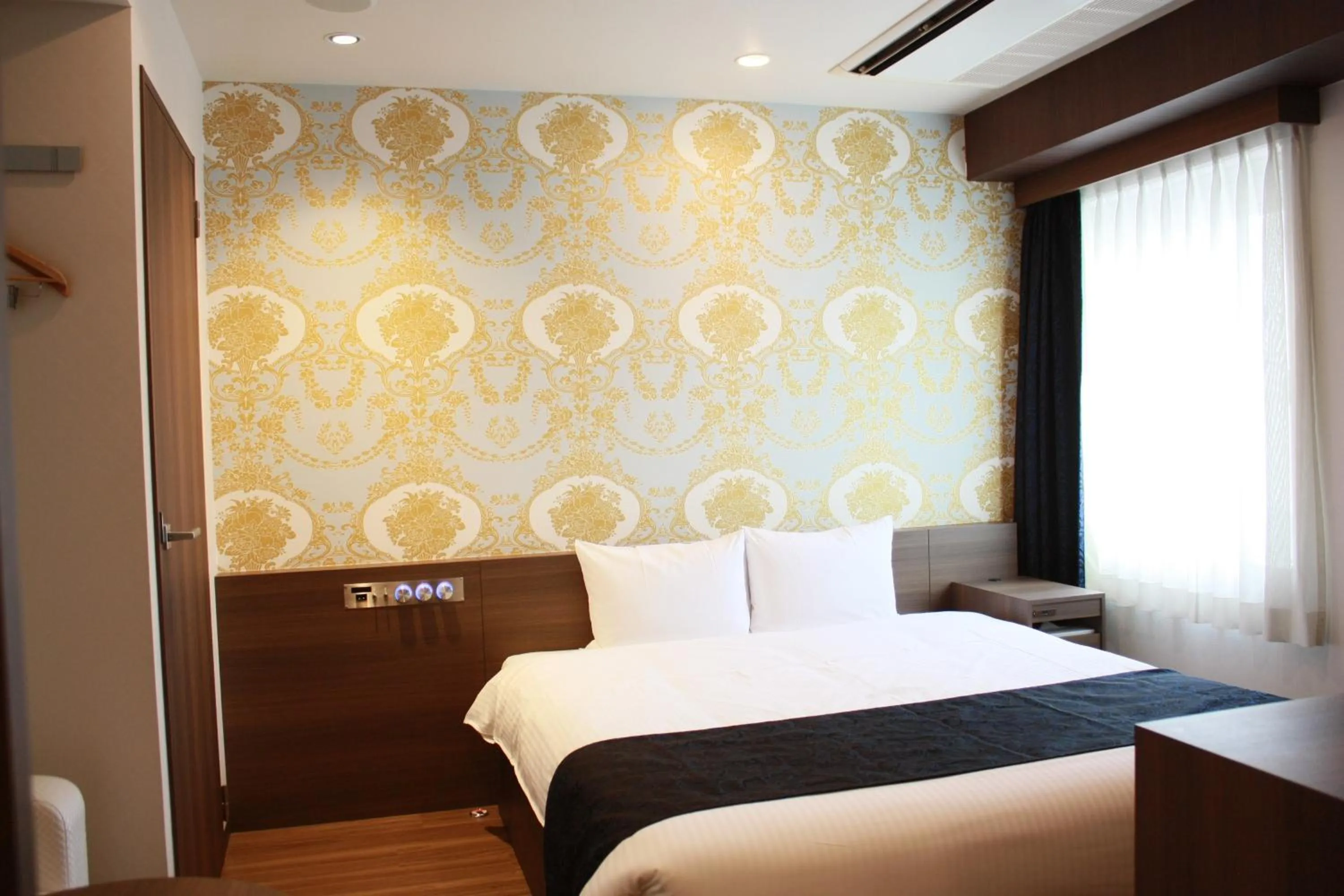 Bed in Hotel LiVEMAX Umeda Central