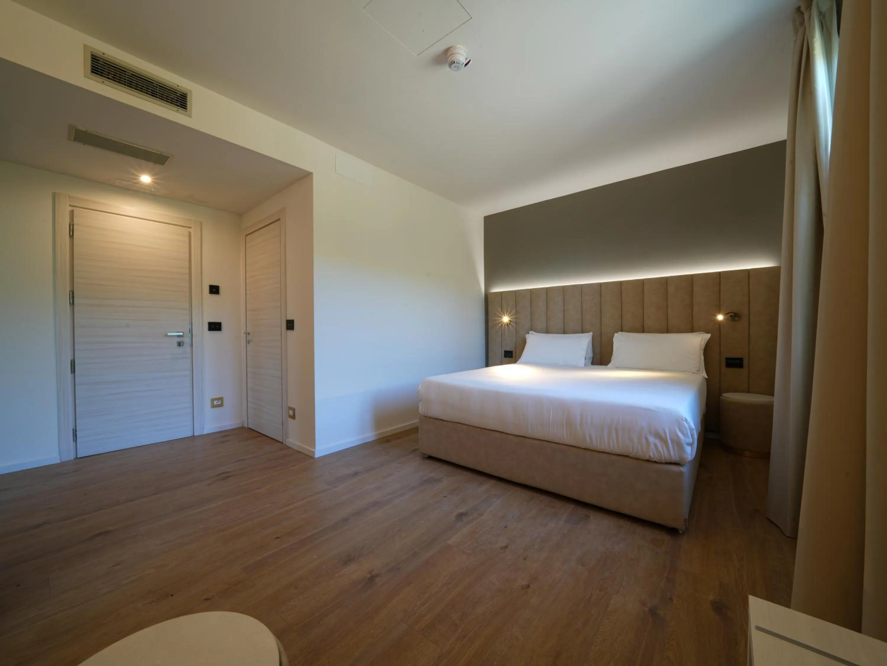 Photo of the whole room, Bed in Hotiday Castiglioncello Suite