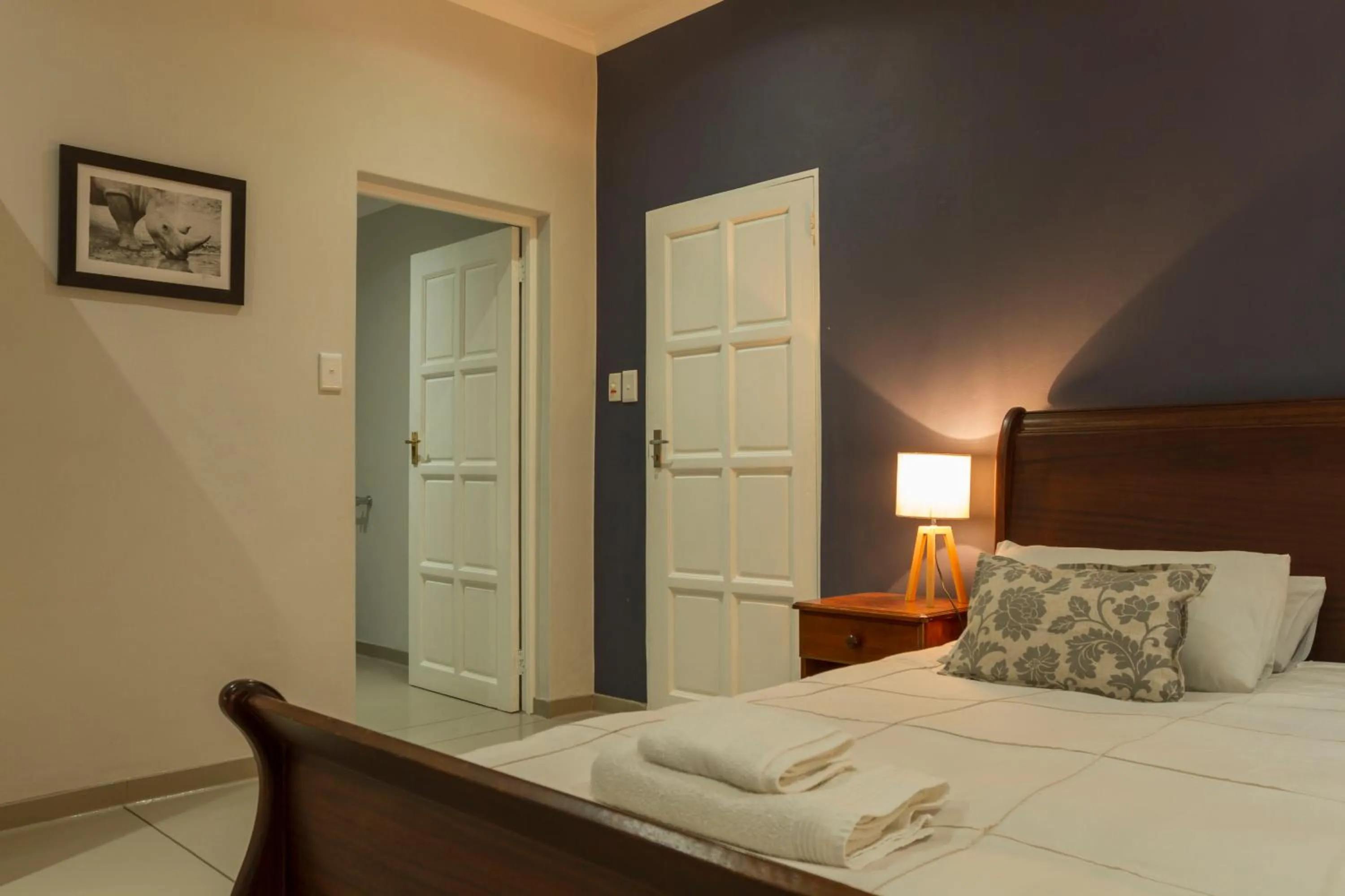 Bed in Kingfisher Creek Safari Cottages