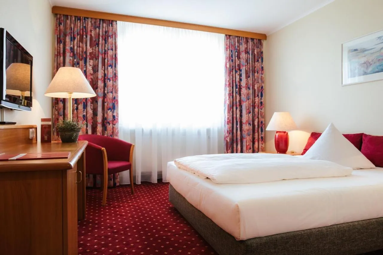 Photo of the whole room, Bed in Hotel Rosenstadt & Malxestube Restaurant