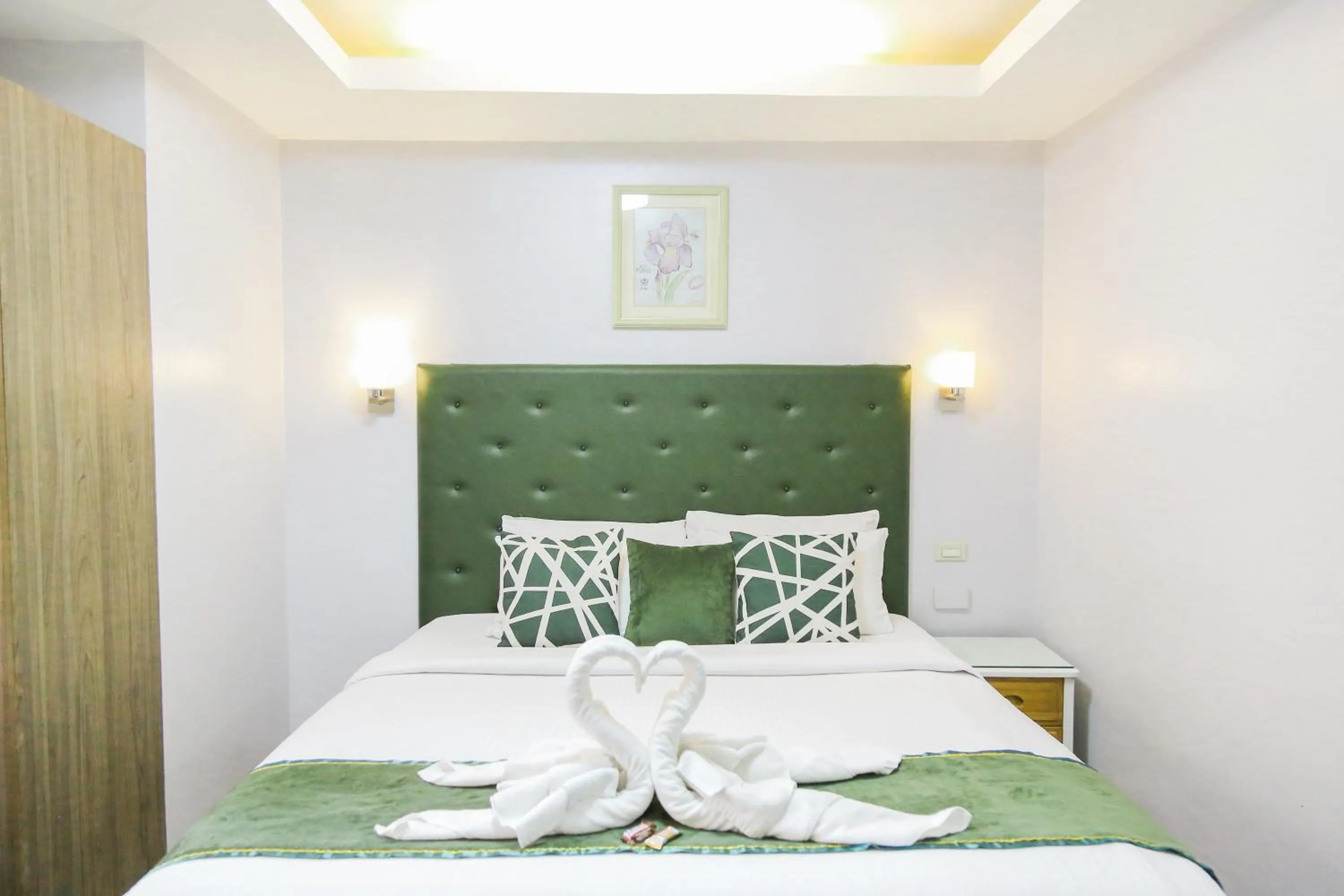 Bed in Pacific Bay Grand Suites