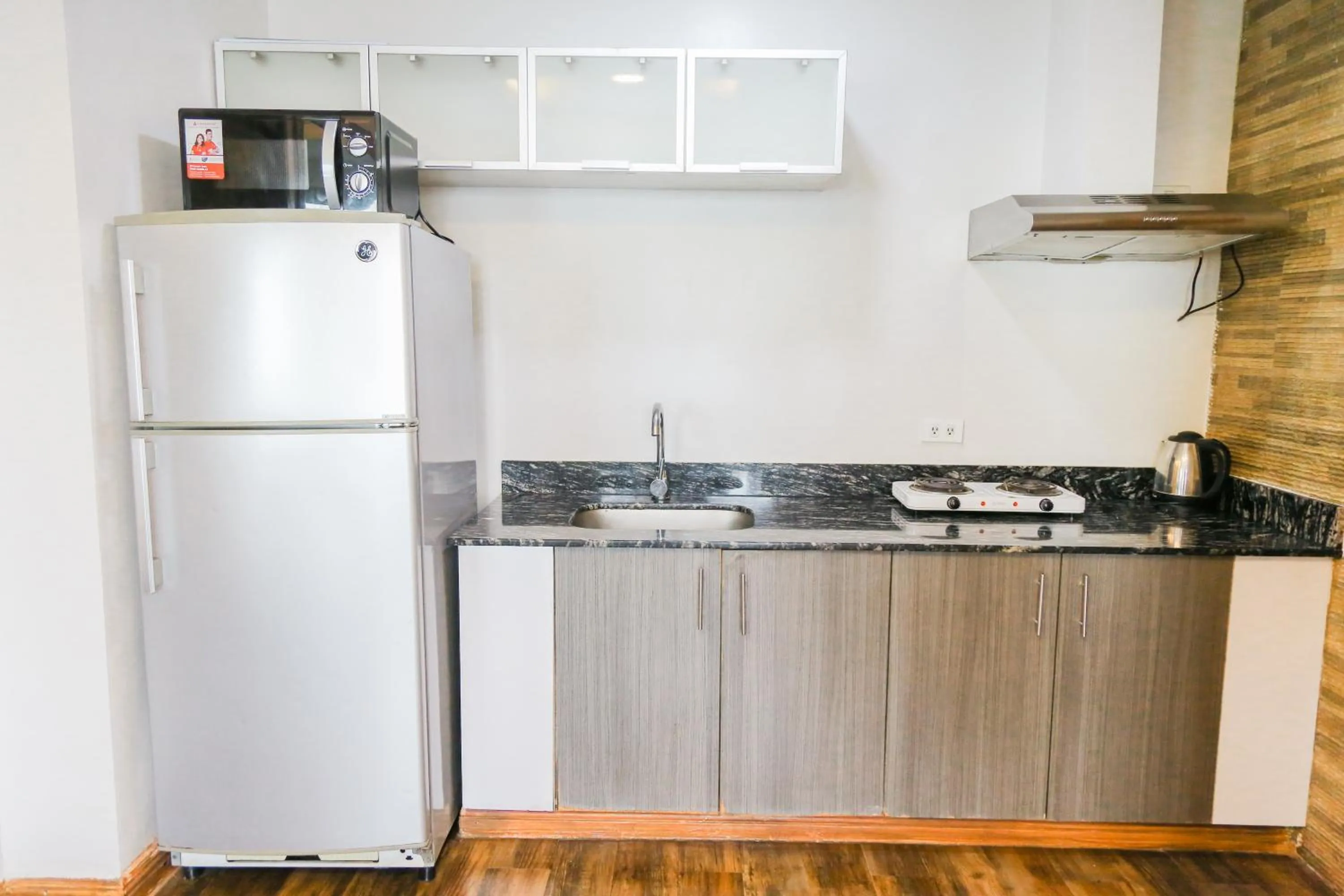 Kitchen or kitchenette in Pacific Bay Grand Suites