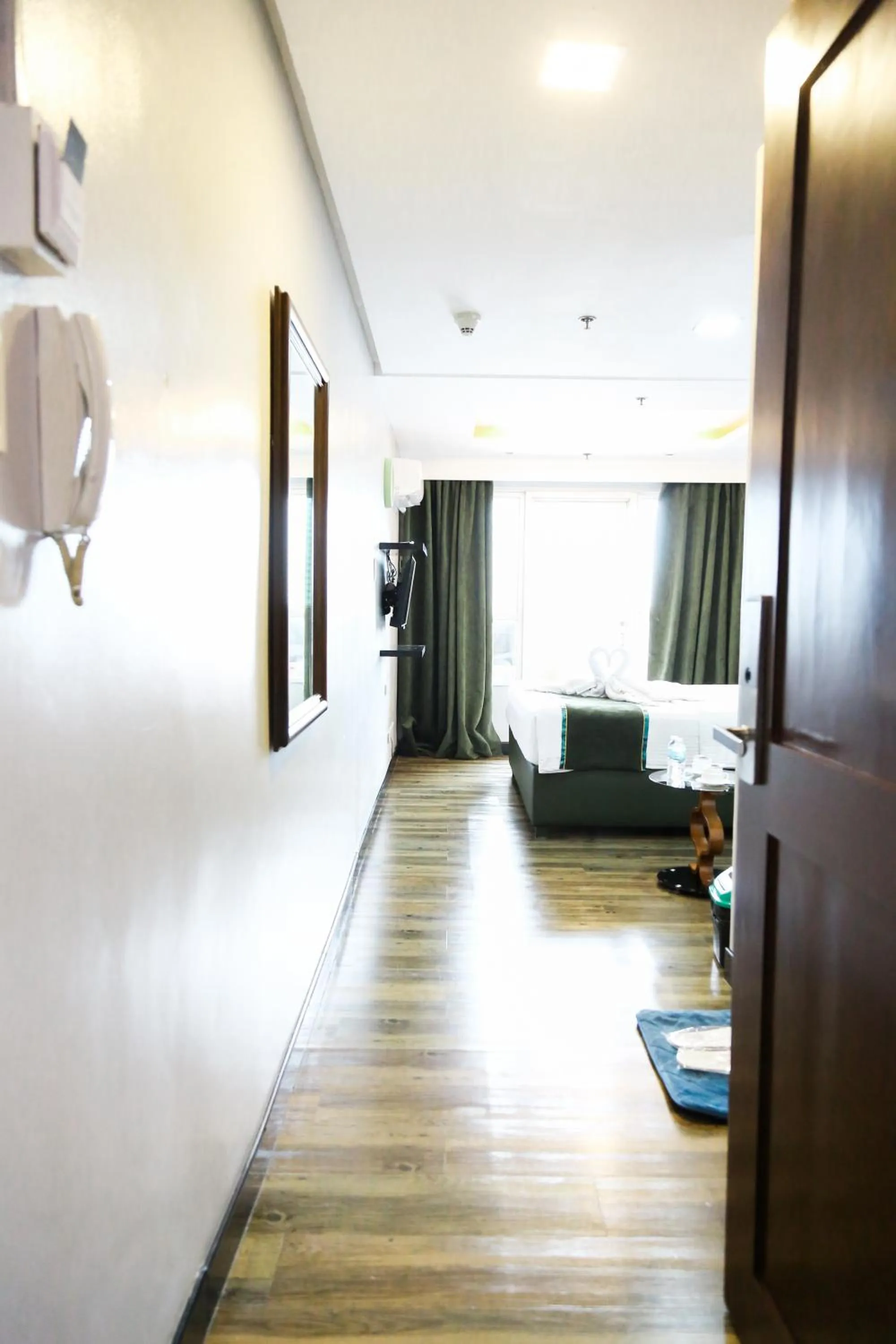 Photo of the whole room, Bed in Pacific Bay Grand Suites