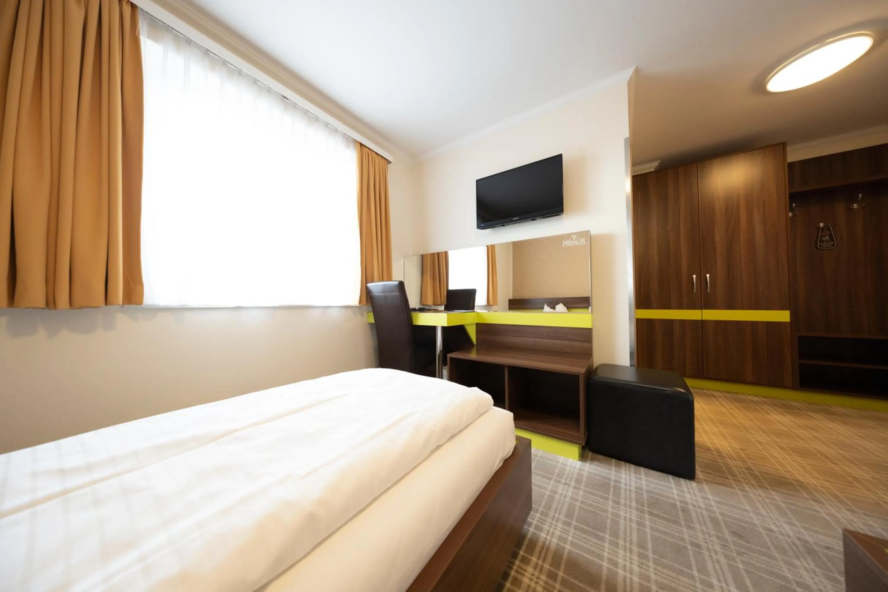 Bed in Primus Hotel & Apartments