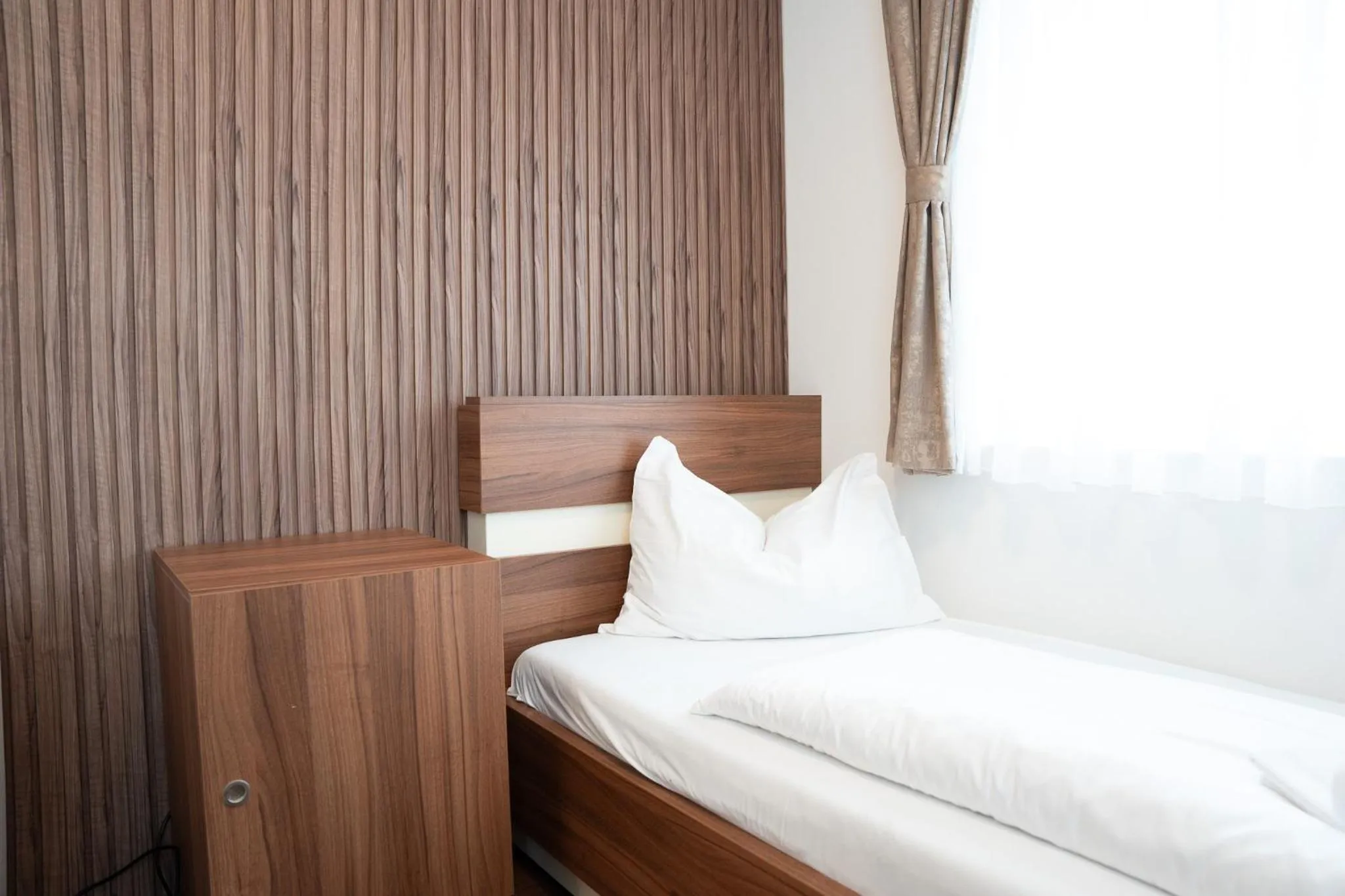 Bed in Primus Hotel & Apartments