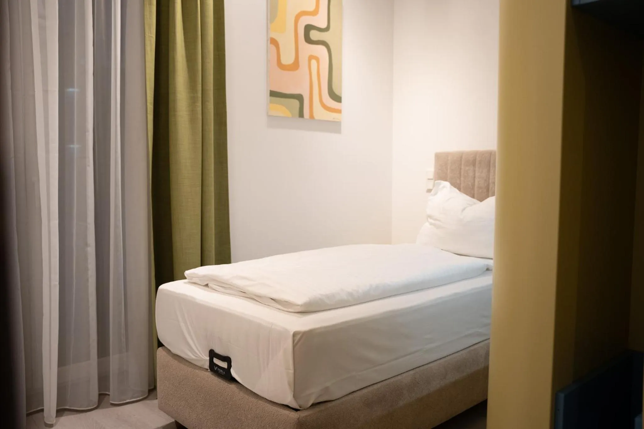 Bed in Primus Hotel & Apartments