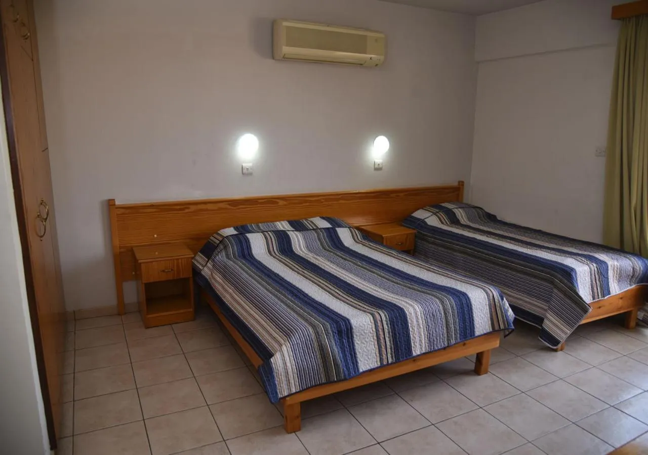 Bed in Elysso Apartments