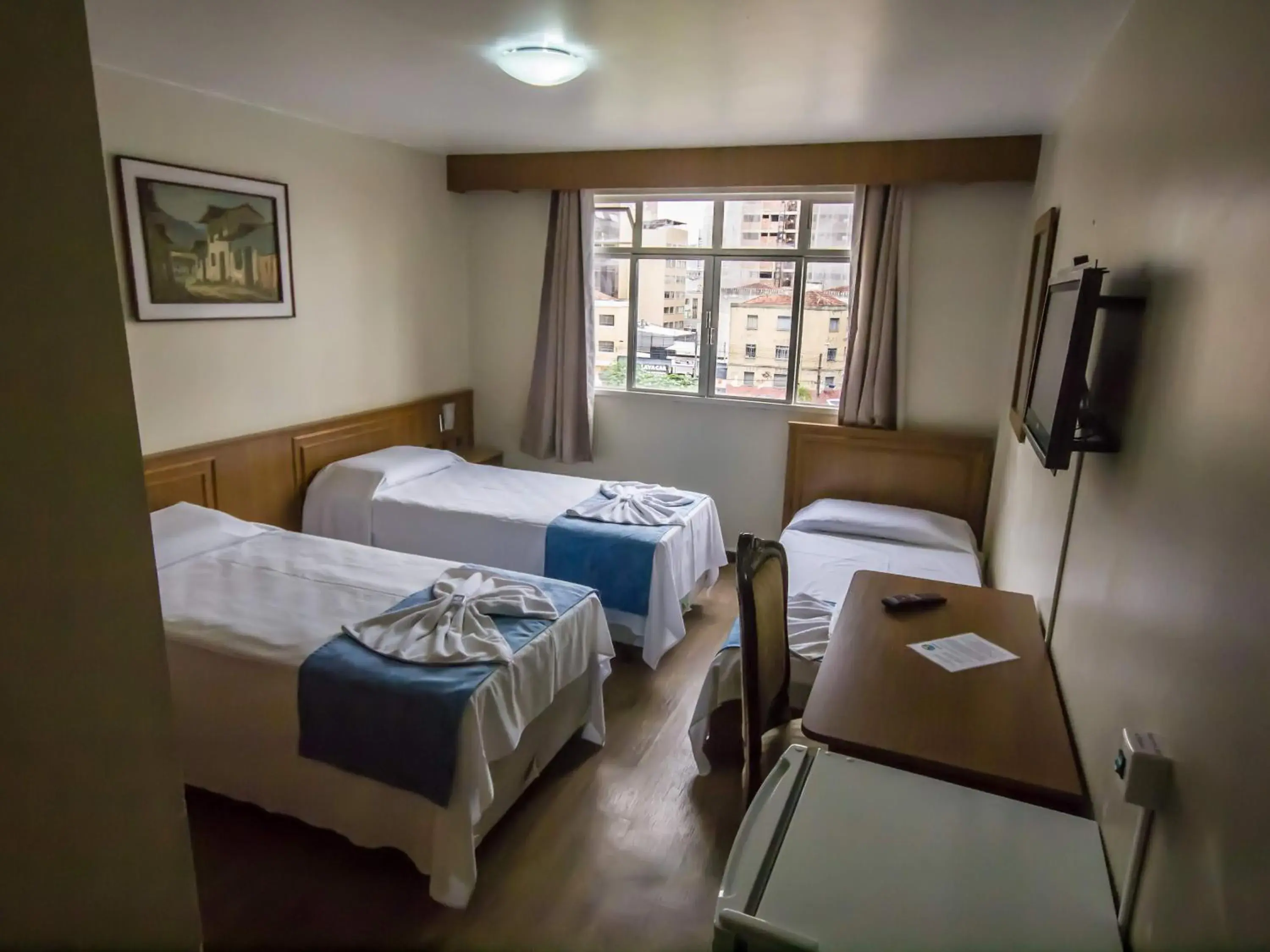 Standard Triple Room with 3 Single Beds - single occupancy in Estrela do Sul Hotel Standard Triple Room with 3 Single Beds - single occupancy in Estrela do Sul Hotel