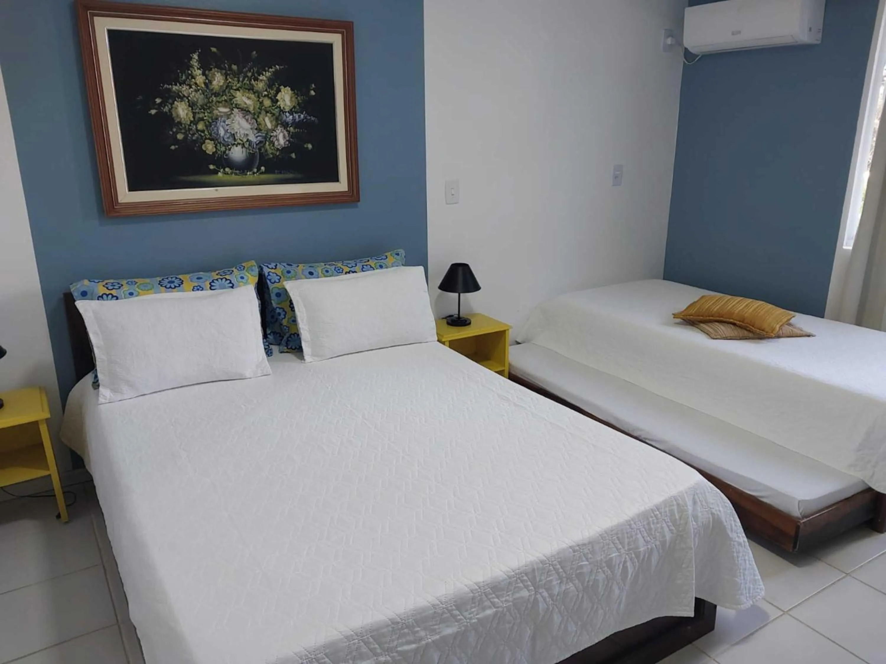 Bed in Flamboyant Hotel