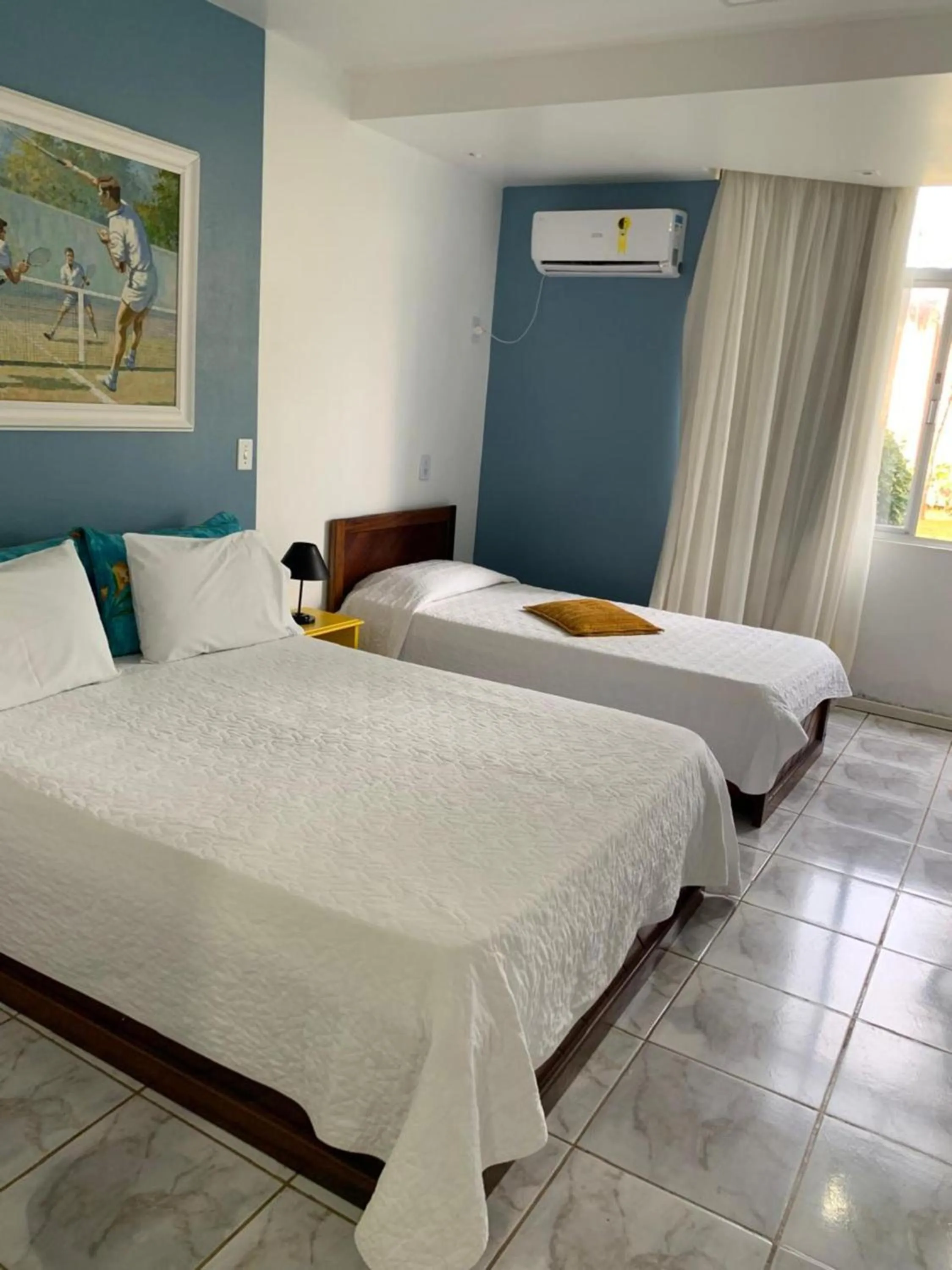 Bed in Flamboyant Hotel