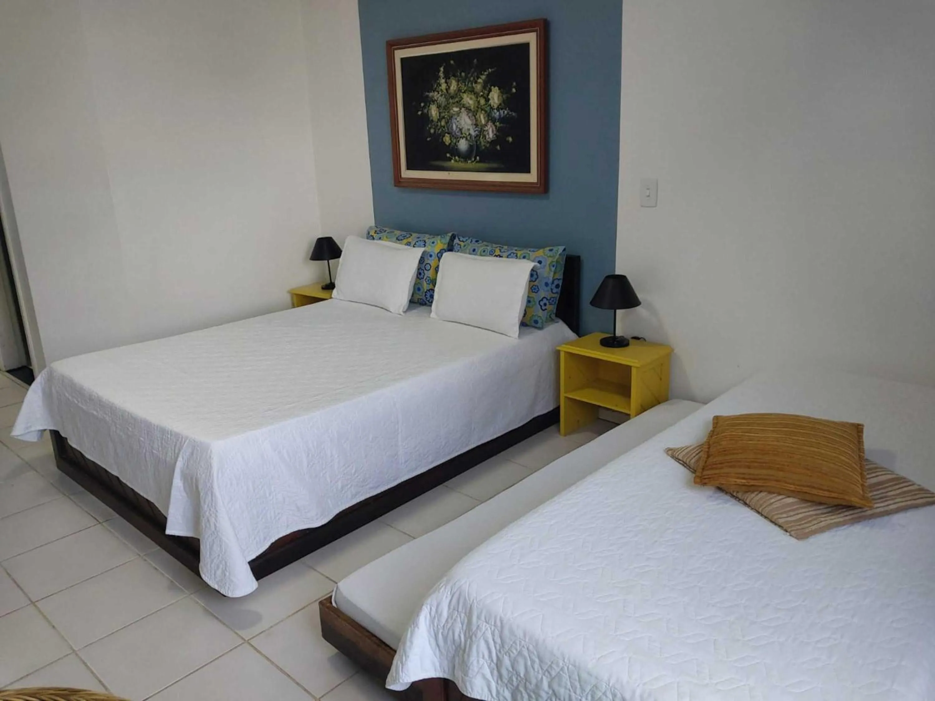 Bed in Flamboyant Hotel