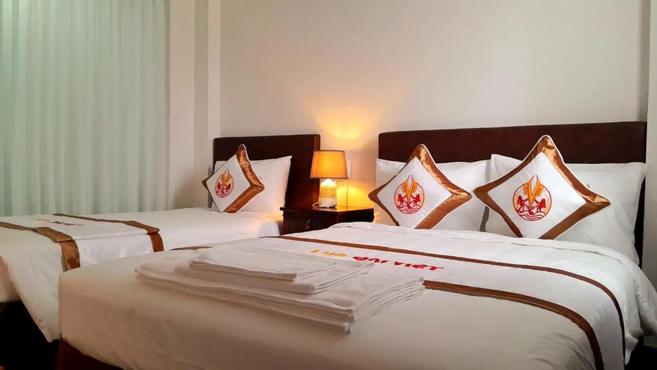 Bed in THE RICE HOTEL