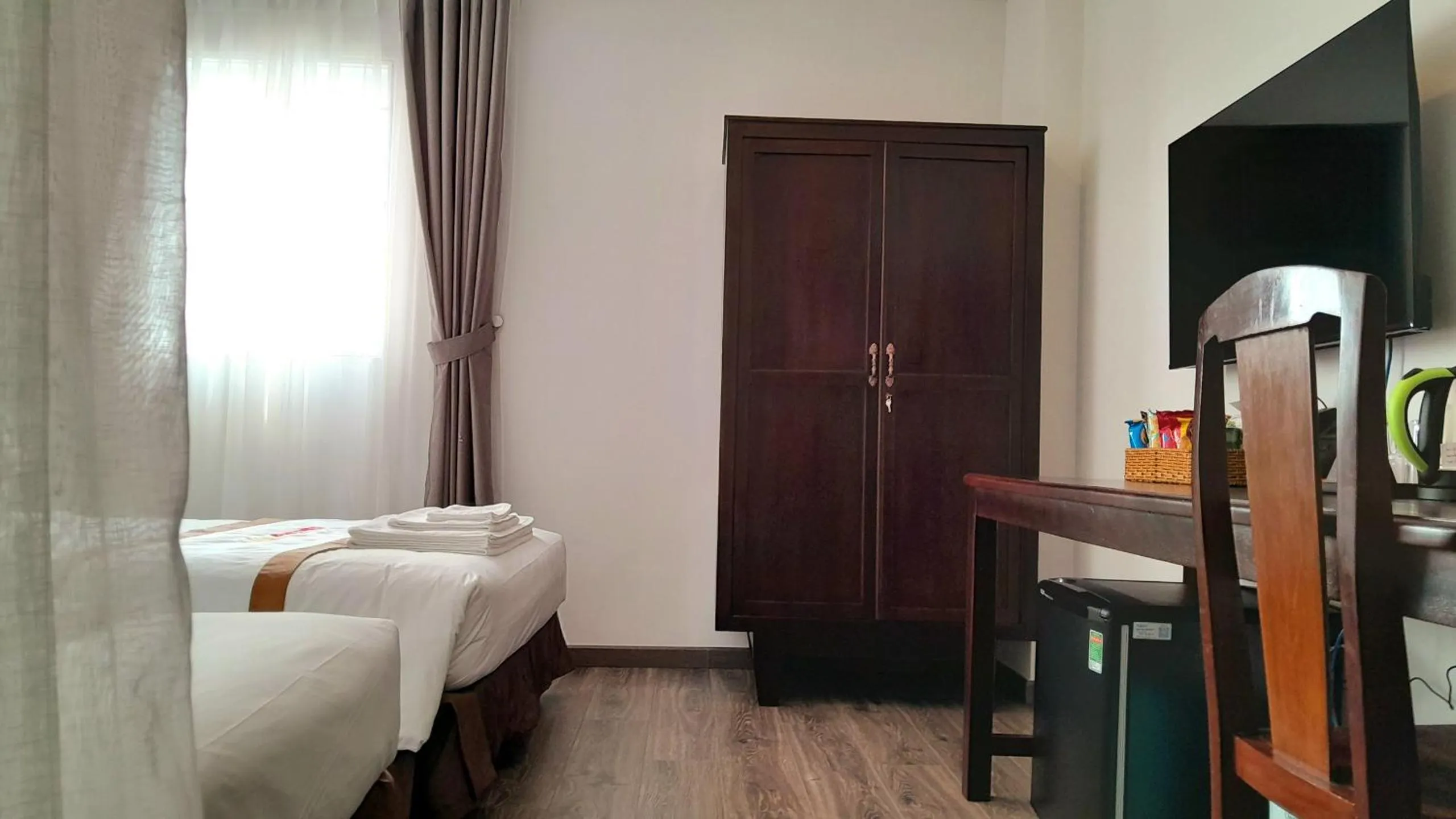 Bed in THE RICE HOTEL