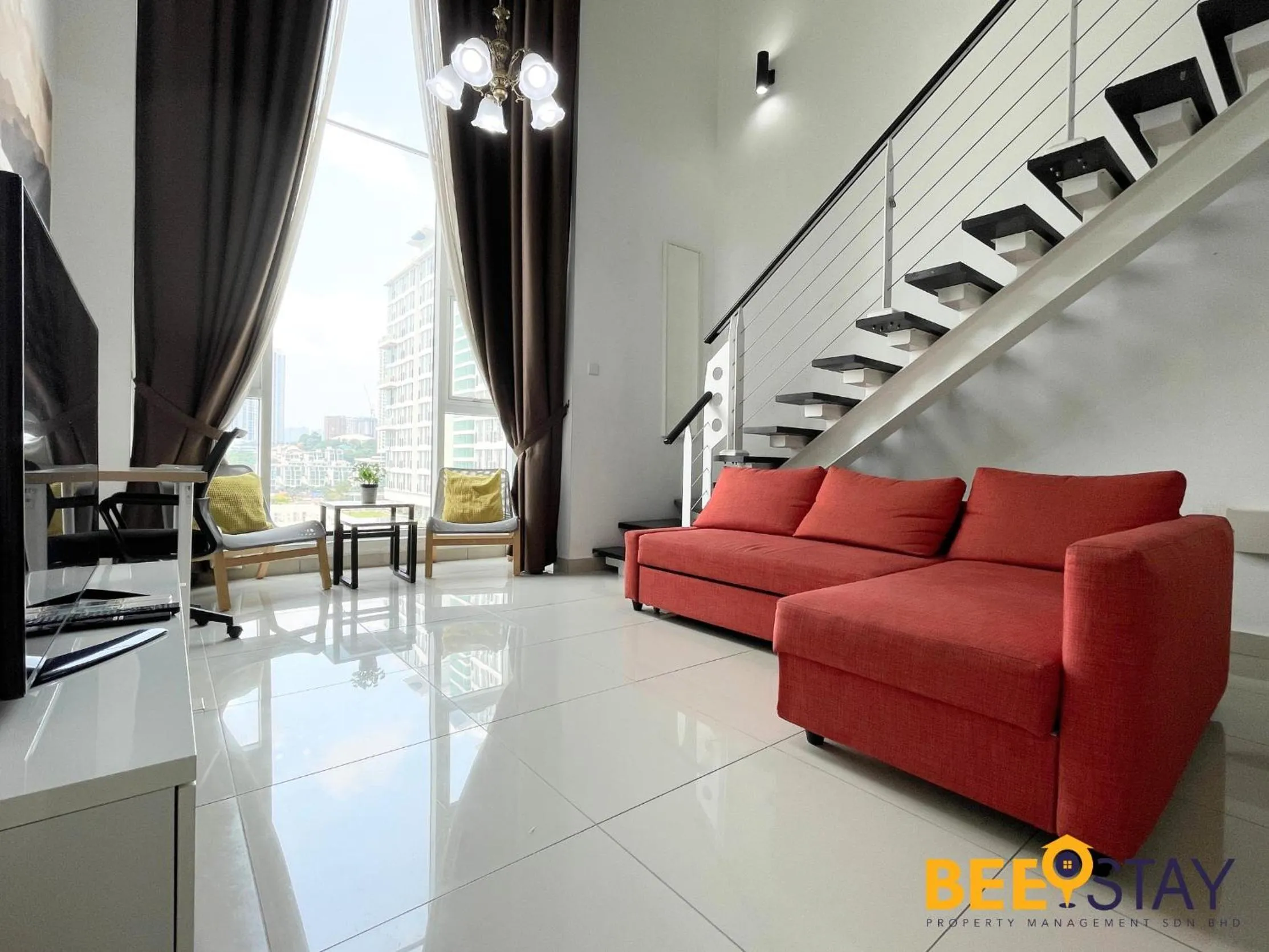 Living room in The Scott Garden Kuala Lumpur by BeeStay Management