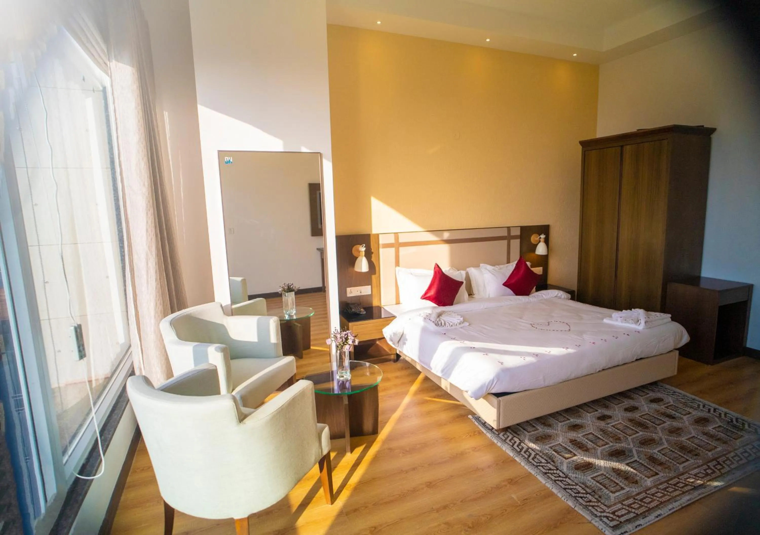 Seating area, Bed in Dhauladhar Heights Resort