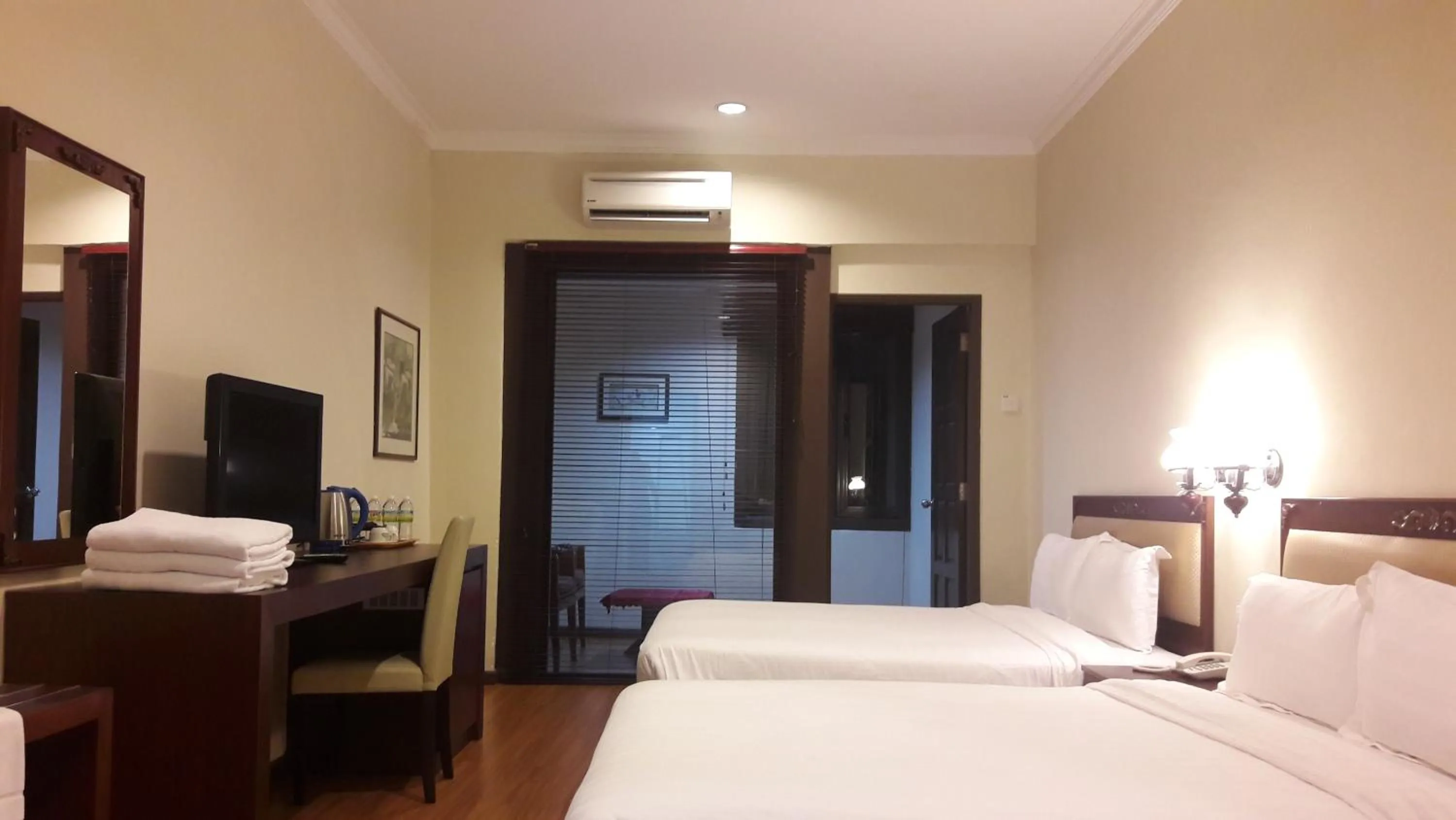 Bed in Cheng Ho Hotel