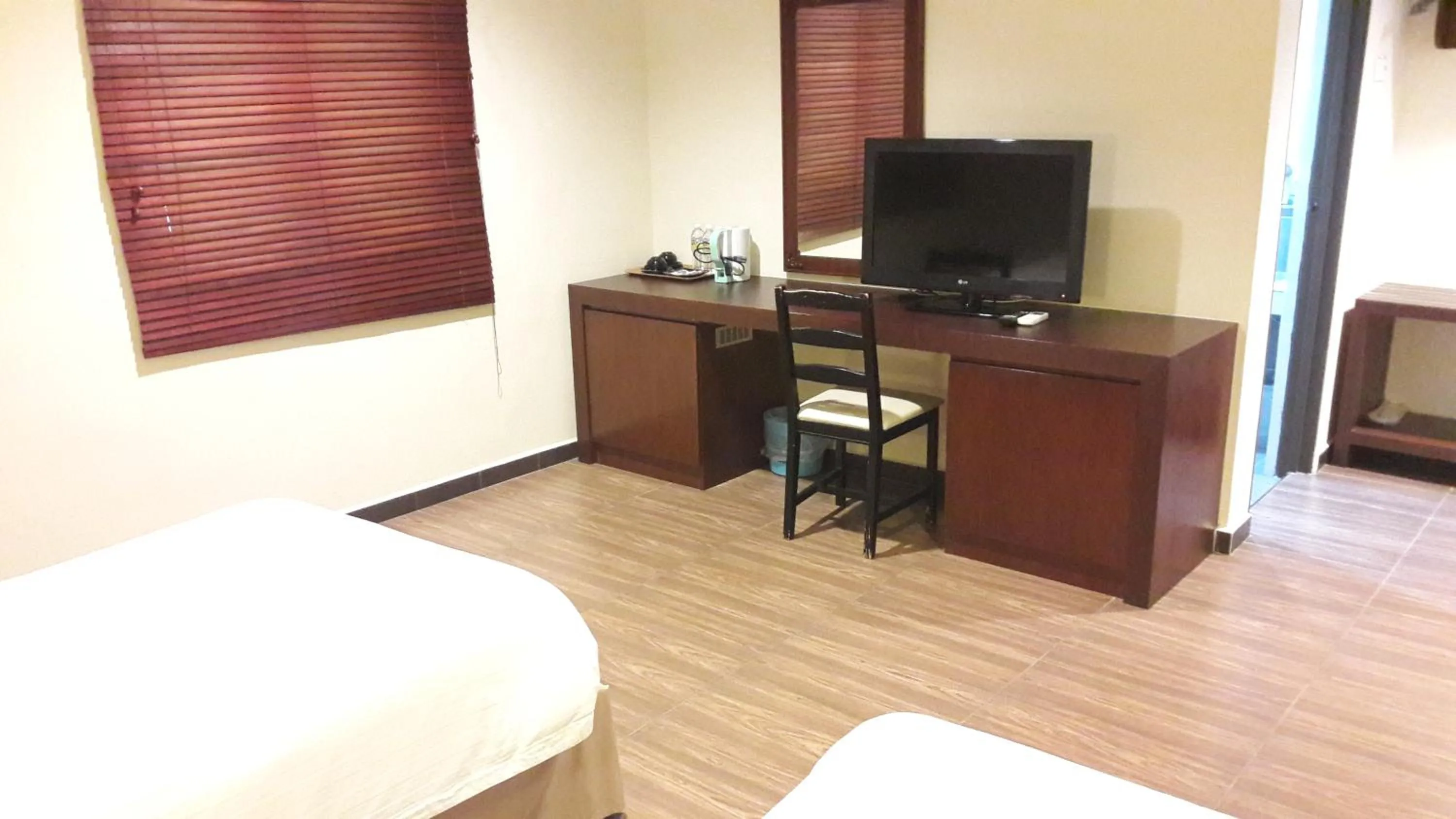 Bed in Cheng Ho Hotel