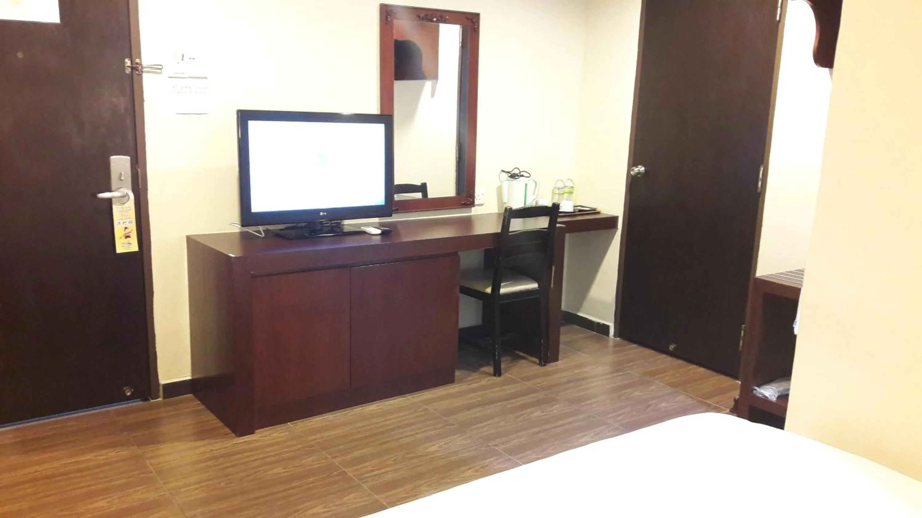 Bed in Cheng Ho Hotel