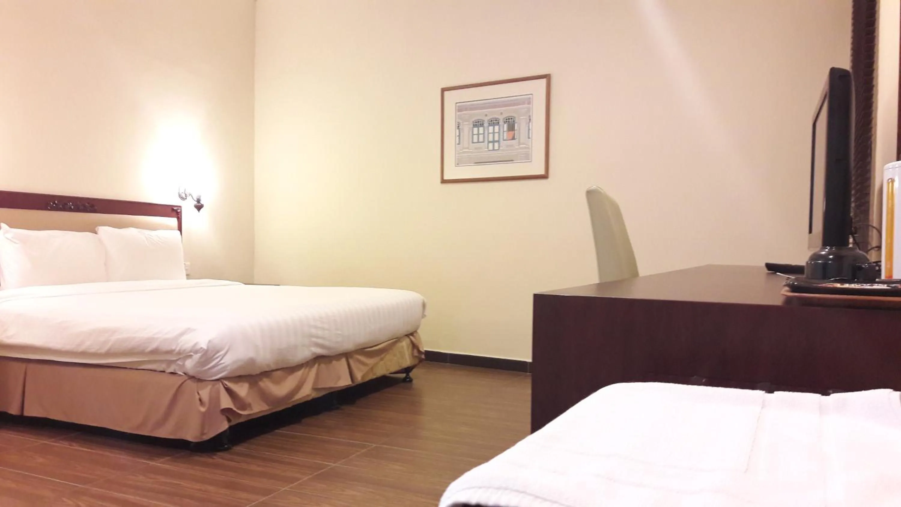 Bed in Cheng Ho Hotel