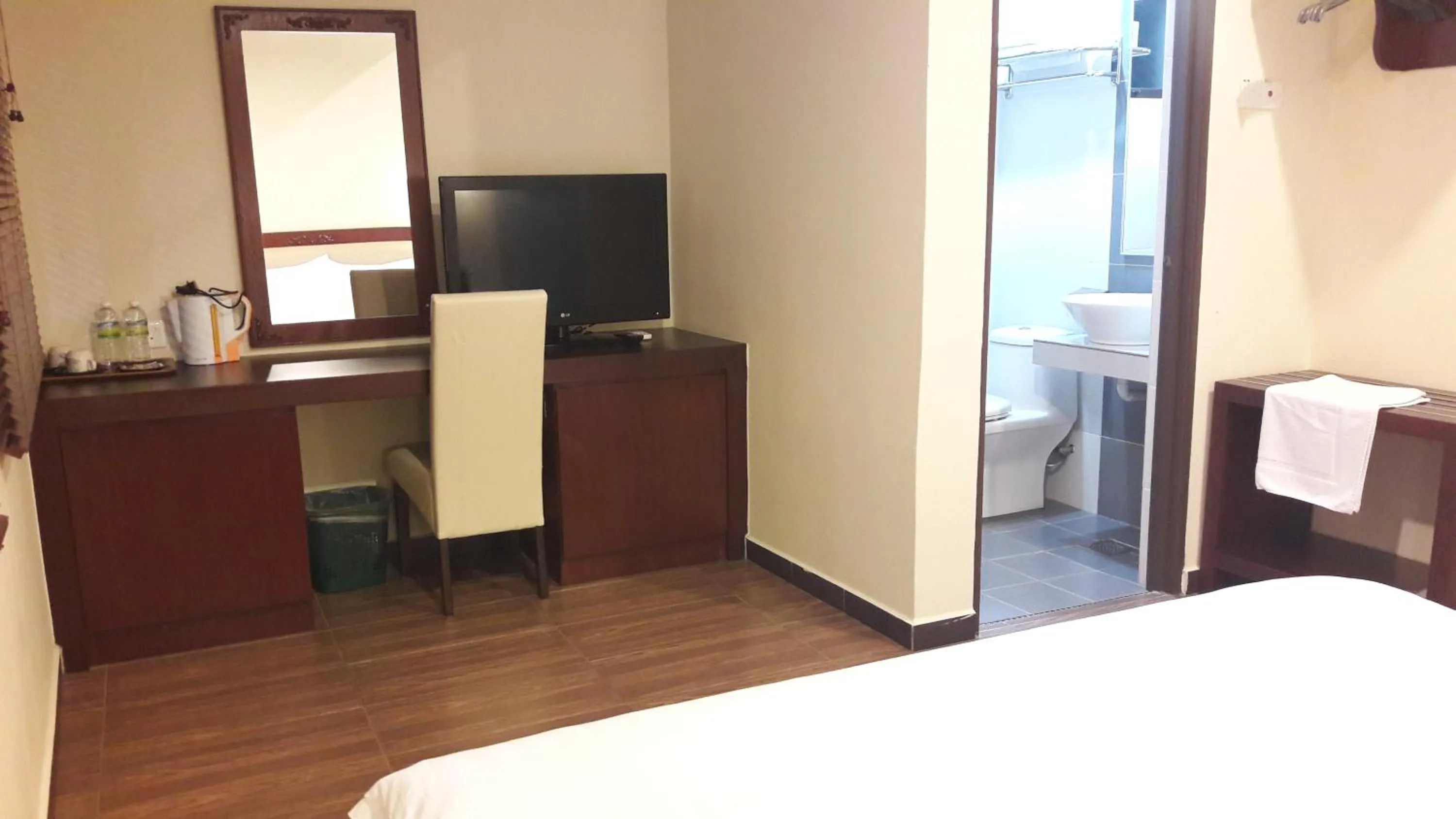 Bed in Cheng Ho Hotel