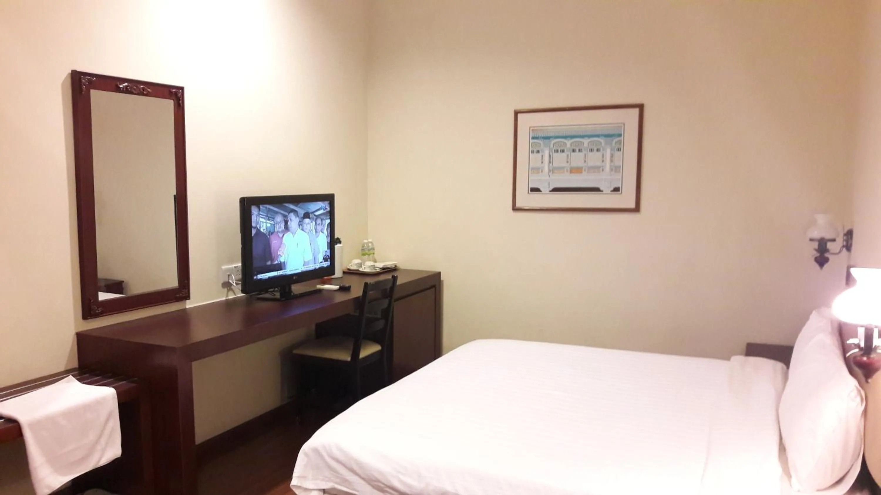 Bed in Cheng Ho Hotel