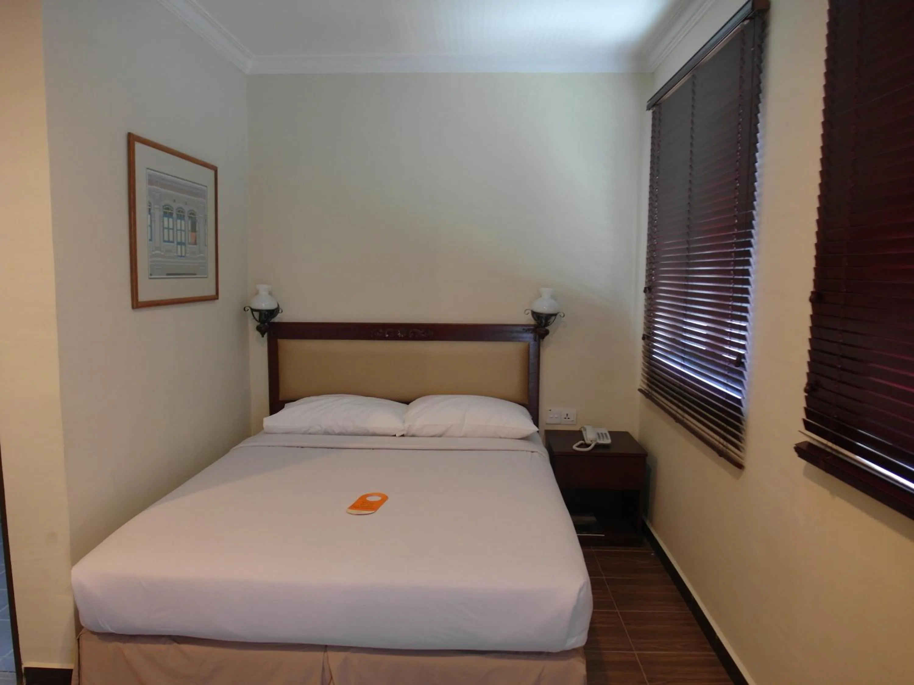 Bed in Cheng Ho Hotel