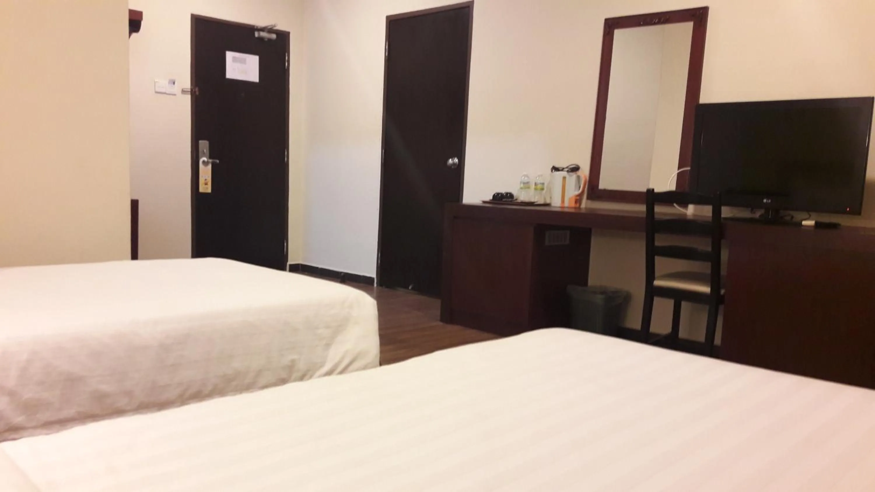 Bed in Cheng Ho Hotel