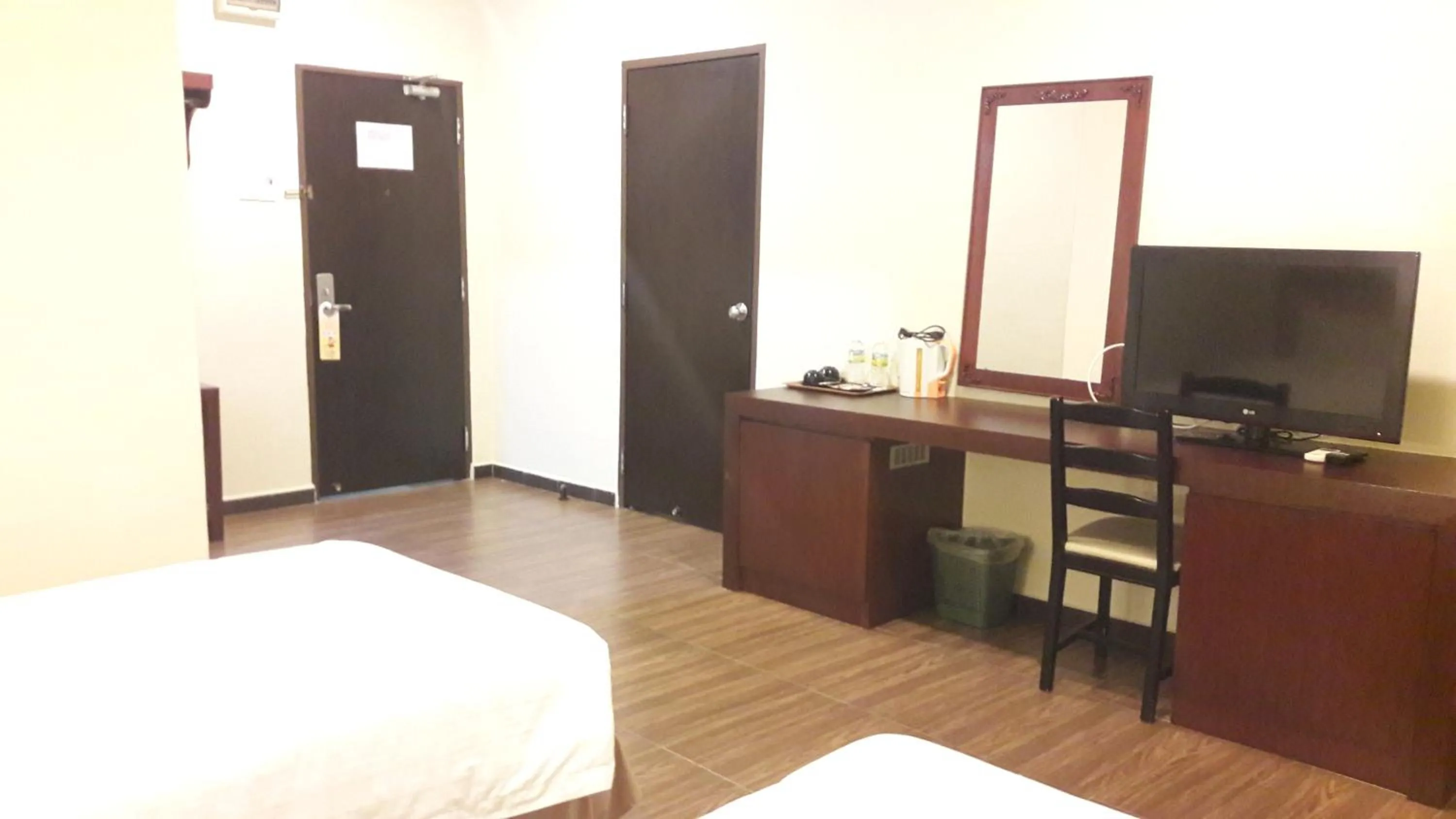 Bed in Cheng Ho Hotel