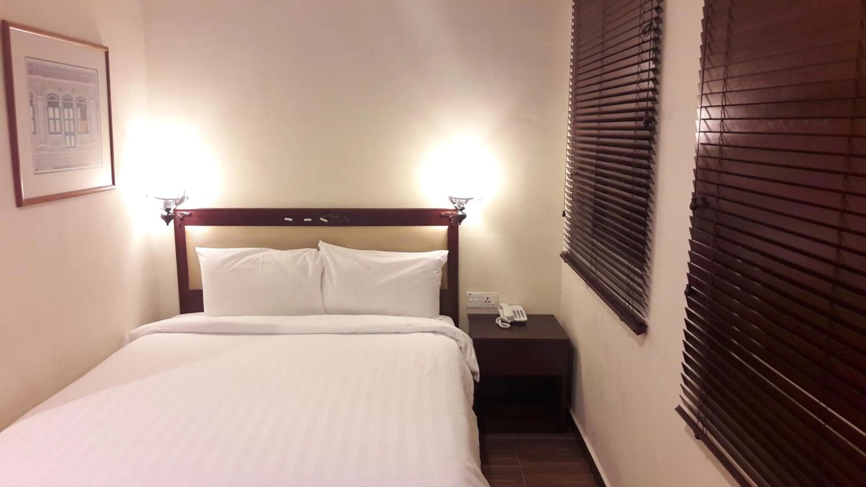 Bed in Cheng Ho Hotel