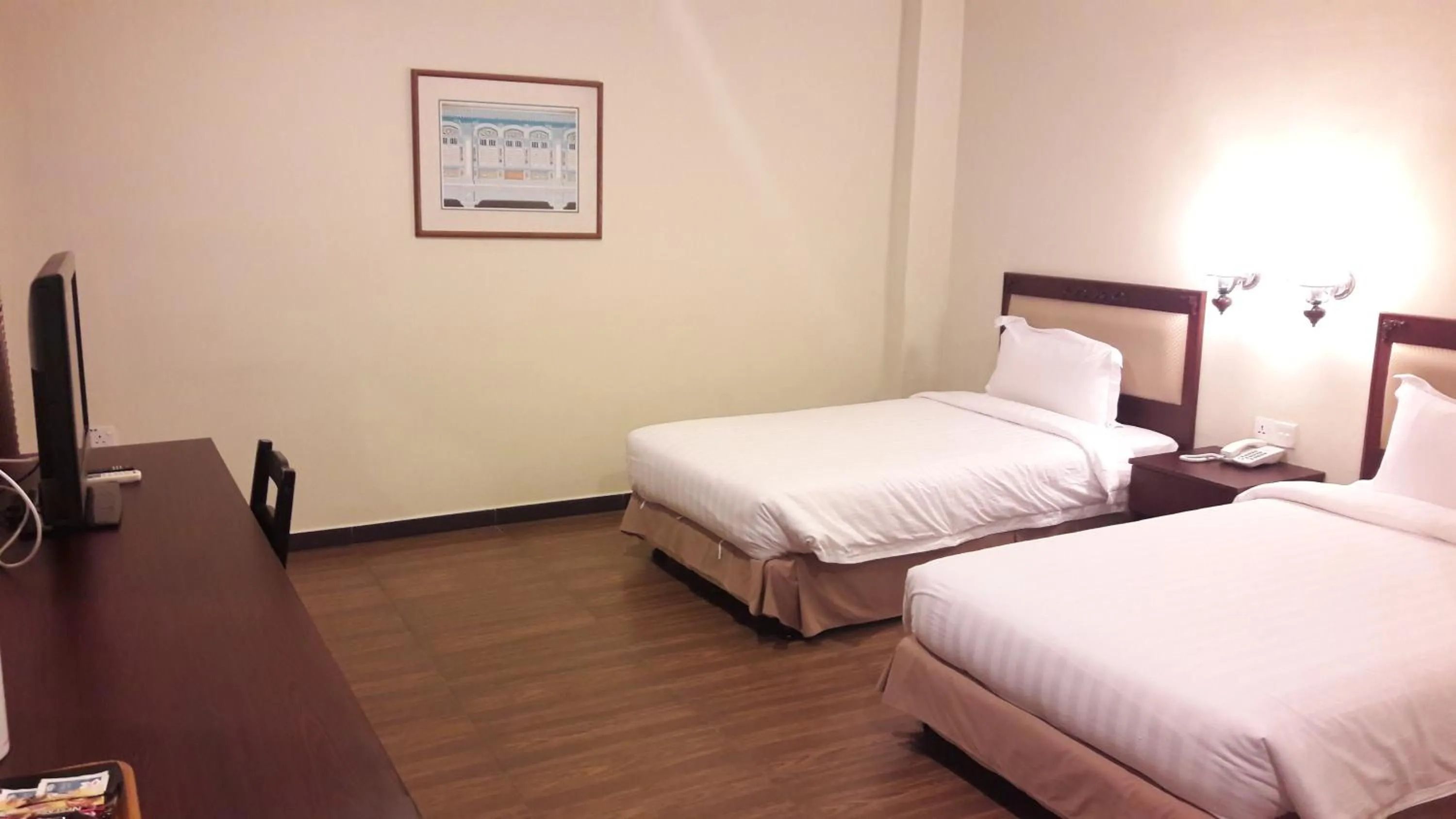 Bed in Cheng Ho Hotel