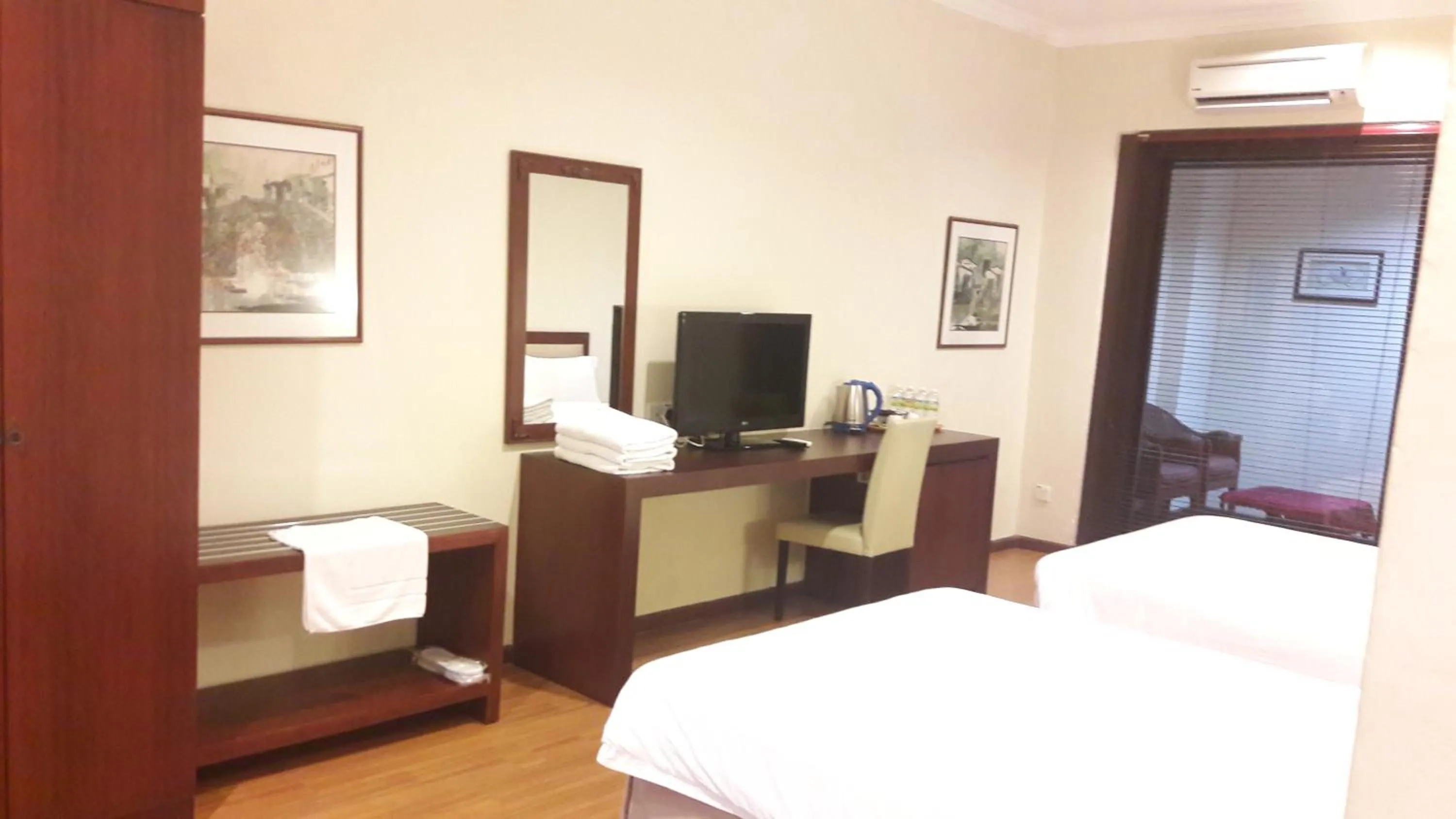 Bed in Cheng Ho Hotel