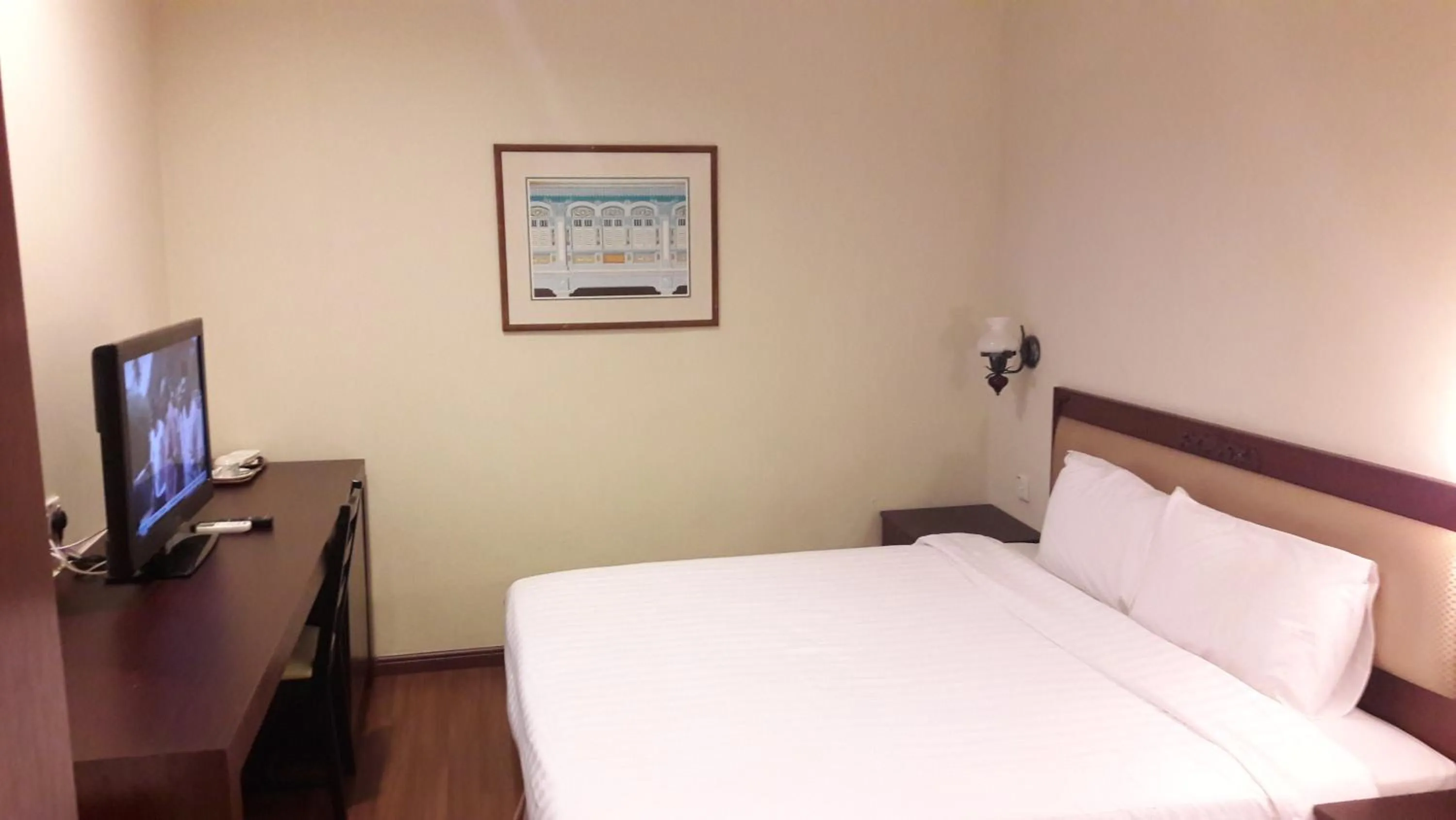 Bed in Cheng Ho Hotel