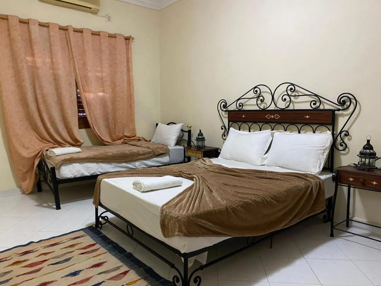 Bed in APPART AIGLE HOTEL