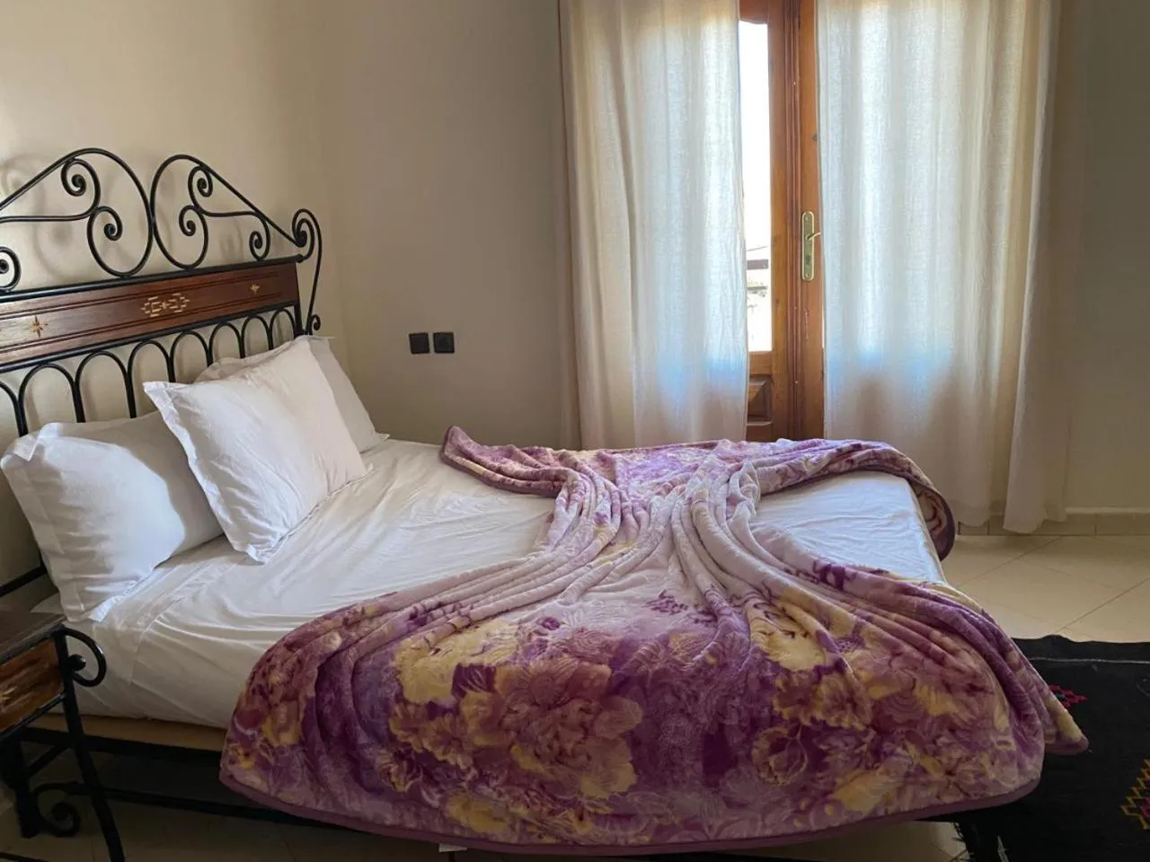 Bed in APPART AIGLE HOTEL