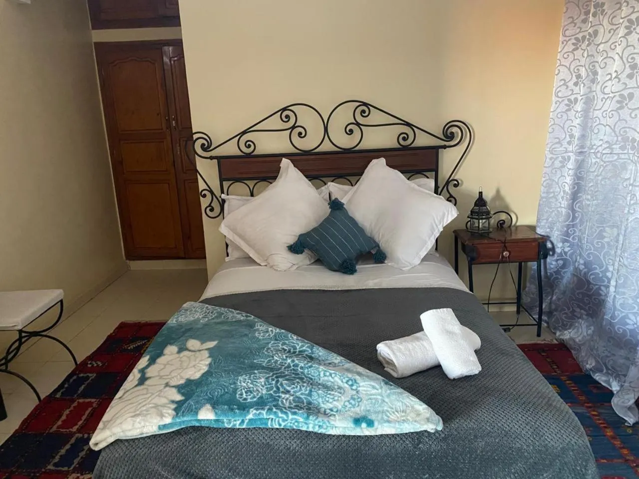 Bed in APPART AIGLE HOTEL