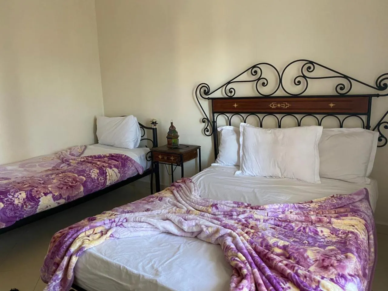 Bed in APPART AIGLE HOTEL