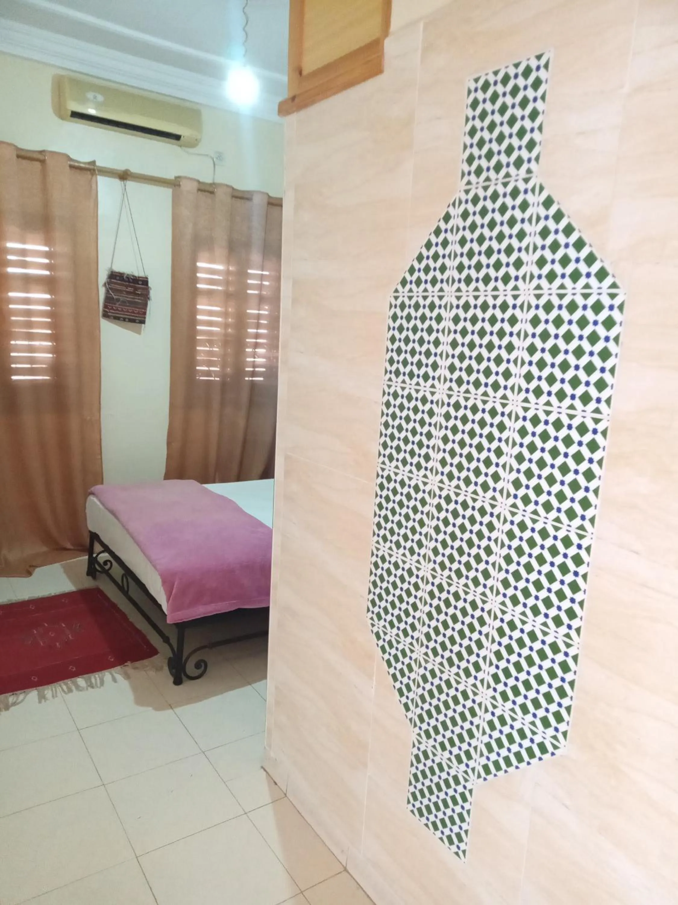 Bed in APPART AIGLE HOTEL