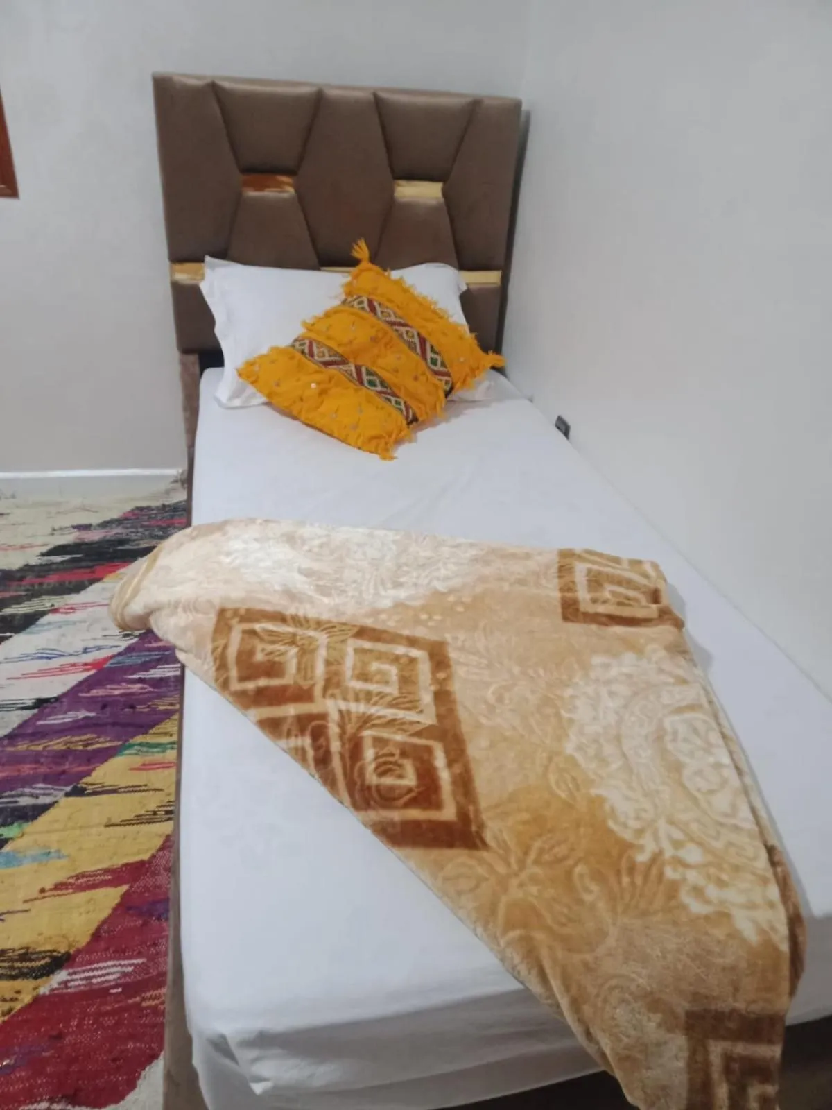 Bed in APPART AIGLE HOTEL