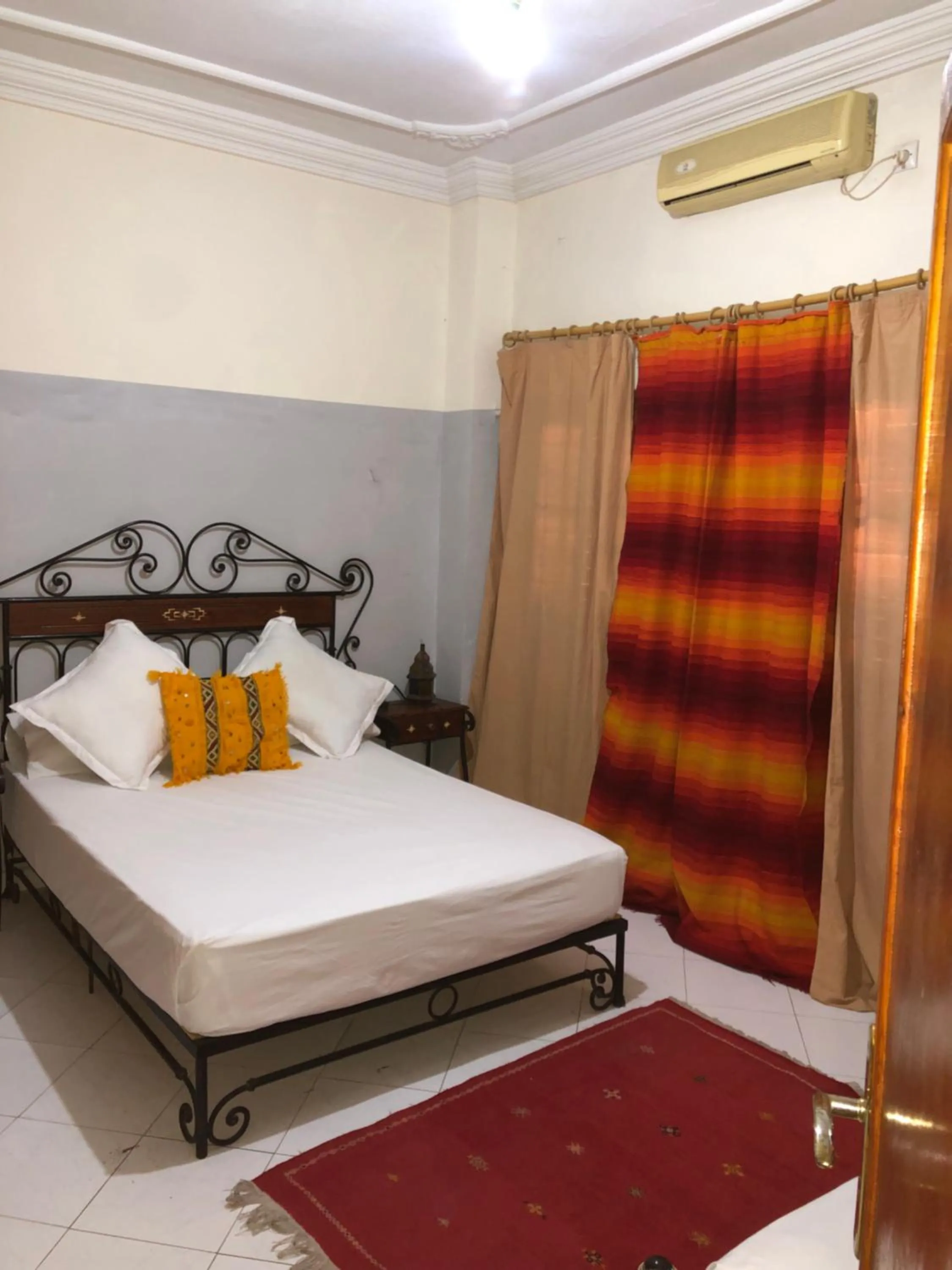 Bed in APPART AIGLE HOTEL