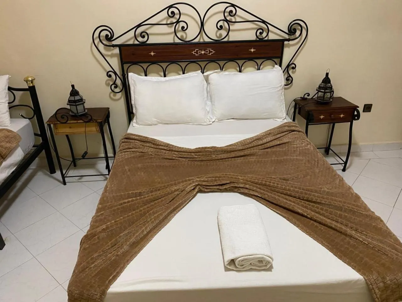 Bed in APPART AIGLE HOTEL