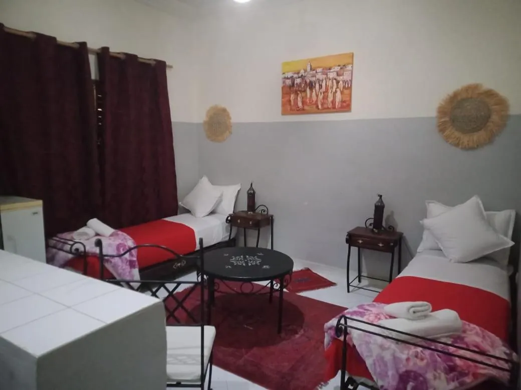 Bed in APPART AIGLE HOTEL