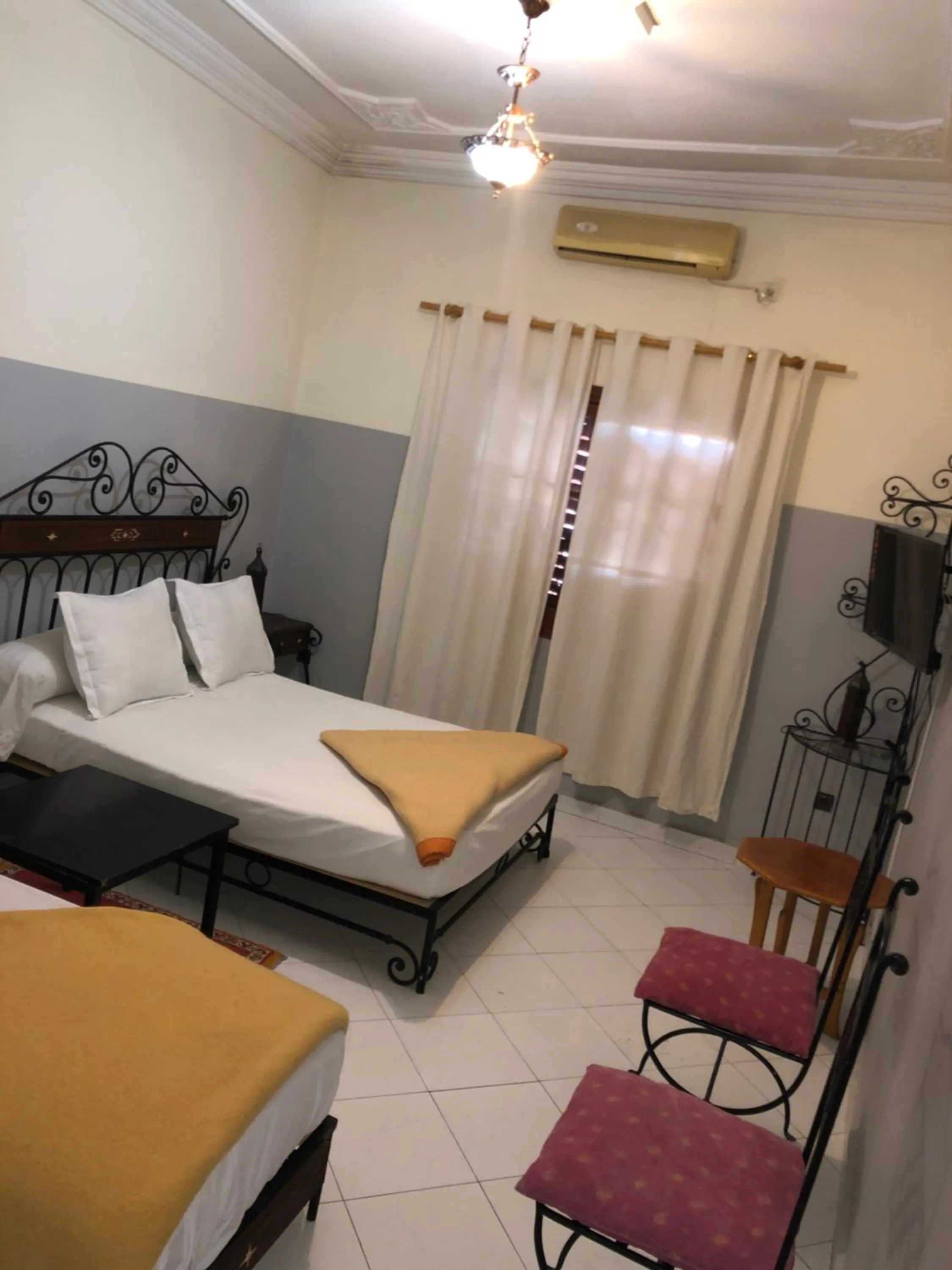 Bed in APPART AIGLE HOTEL