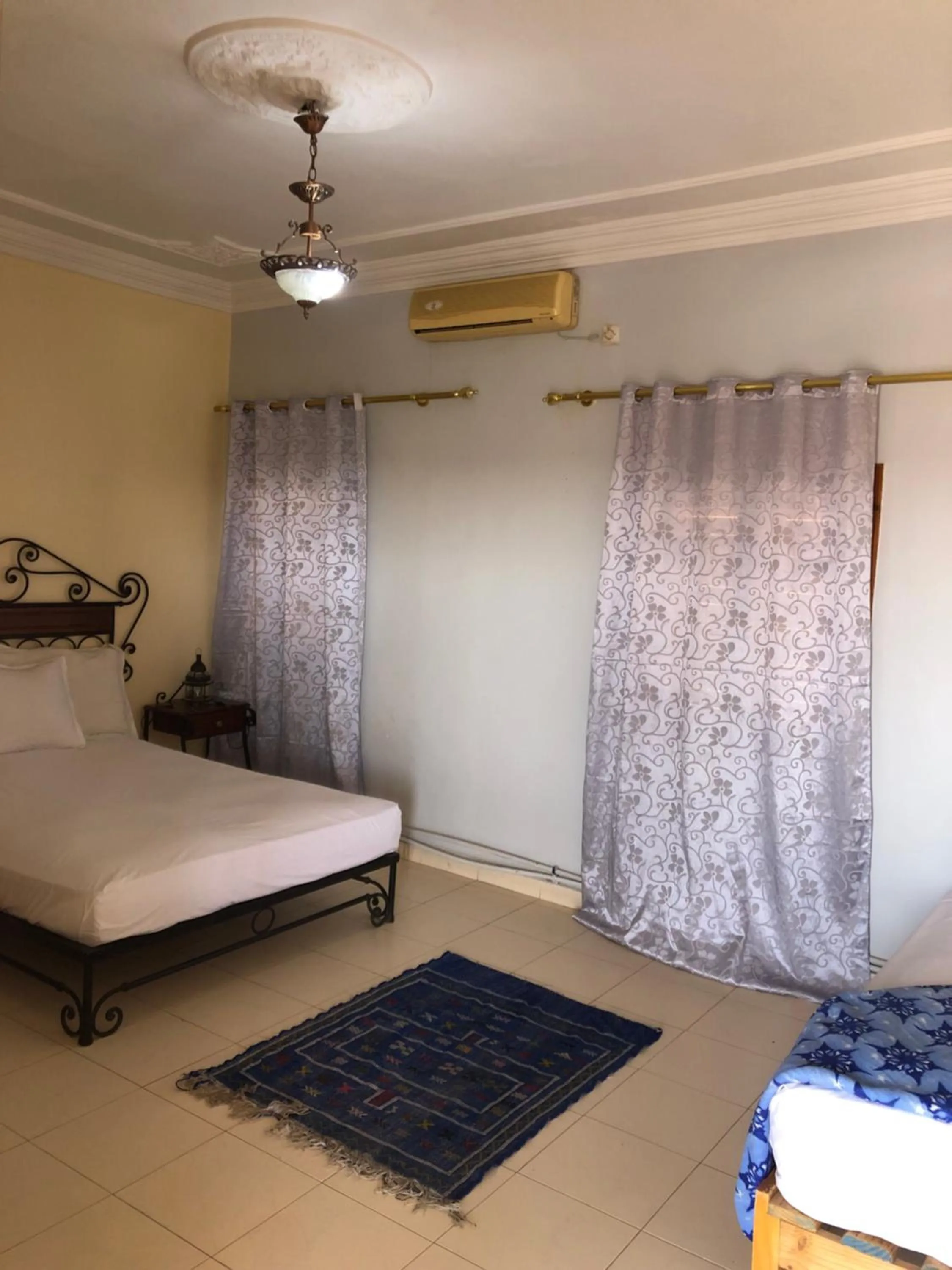 Bed in APPART AIGLE HOTEL