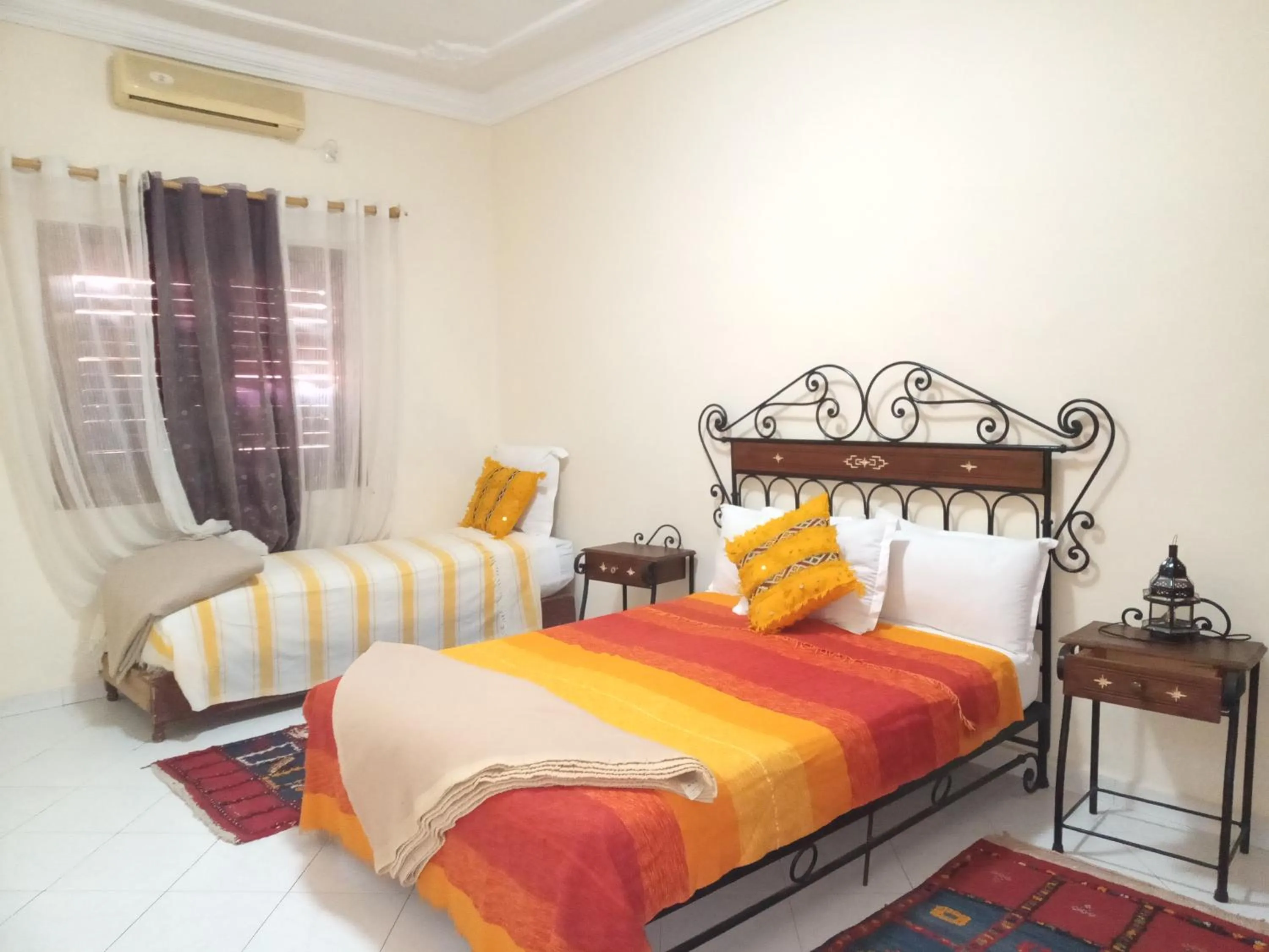 Bed in APPART AIGLE HOTEL