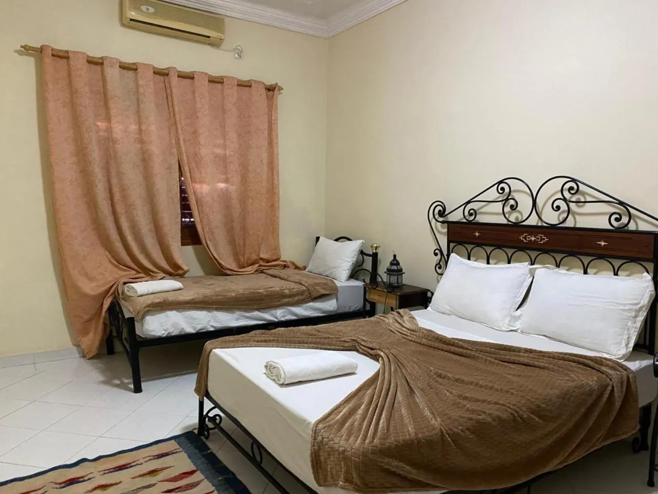 Bed in APPART AIGLE HOTEL