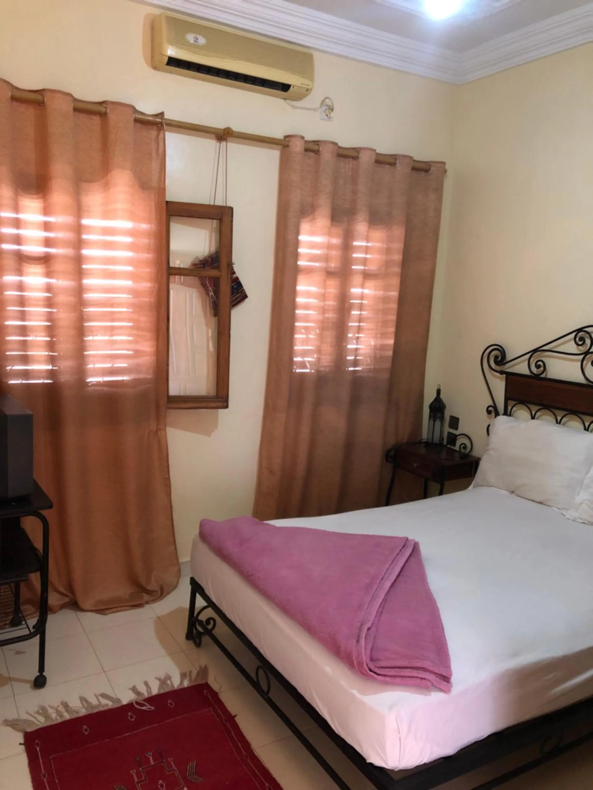 Bed in APPART AIGLE HOTEL